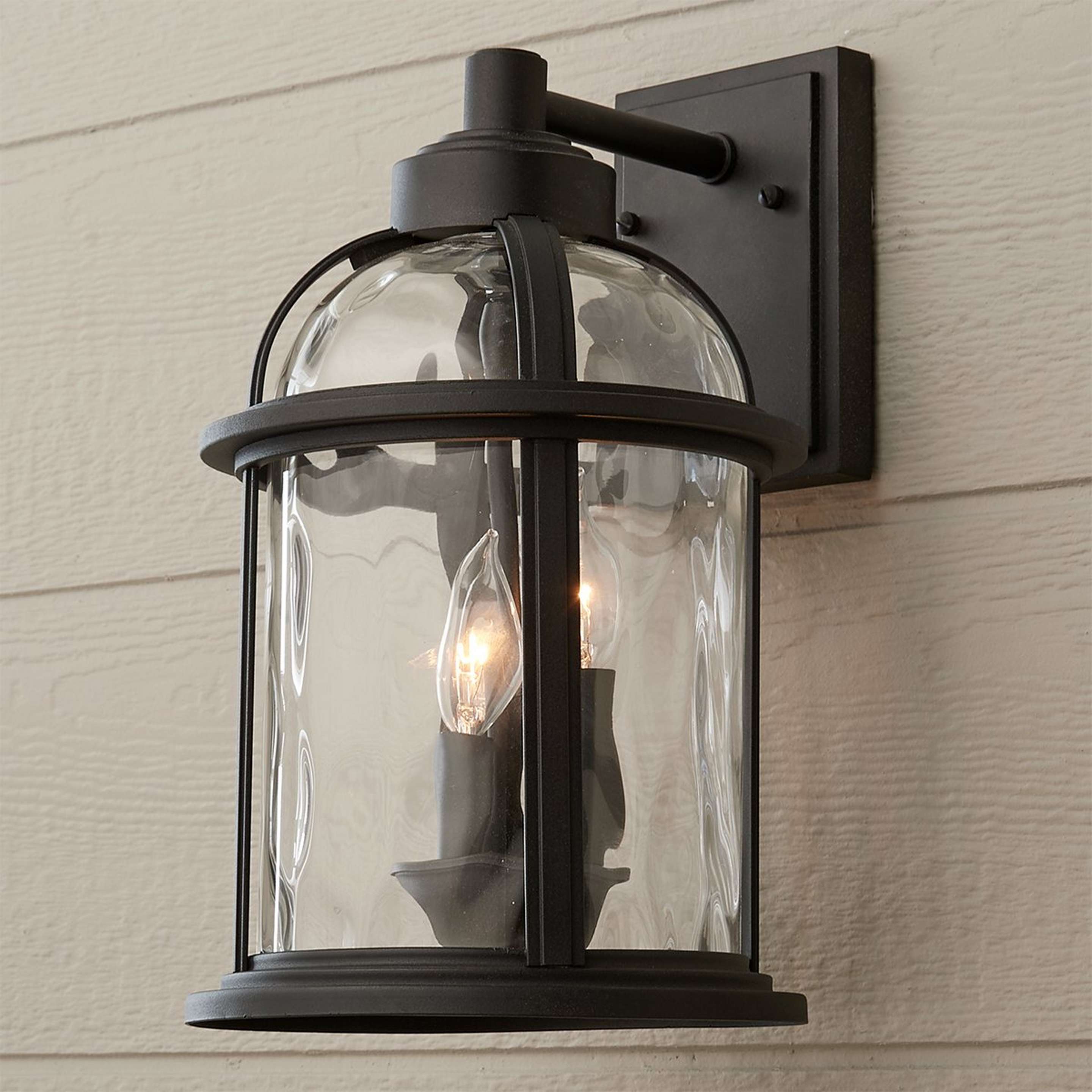 A Undulated Outdoor Sconce - 3 Light with Black / Clear Glass color