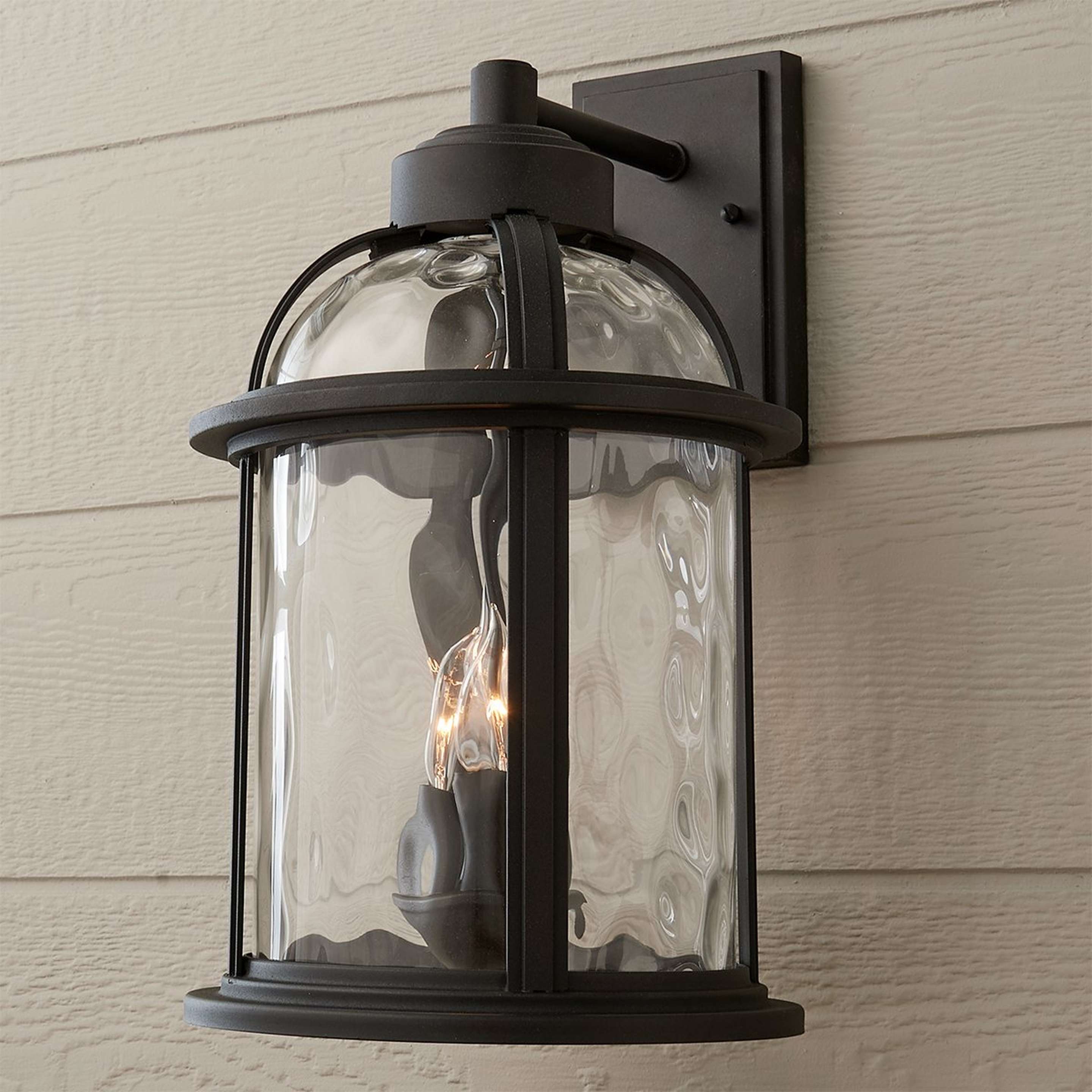 A Undulated Outdoor Sconce - 4 Light with Black / Clear Glass color
