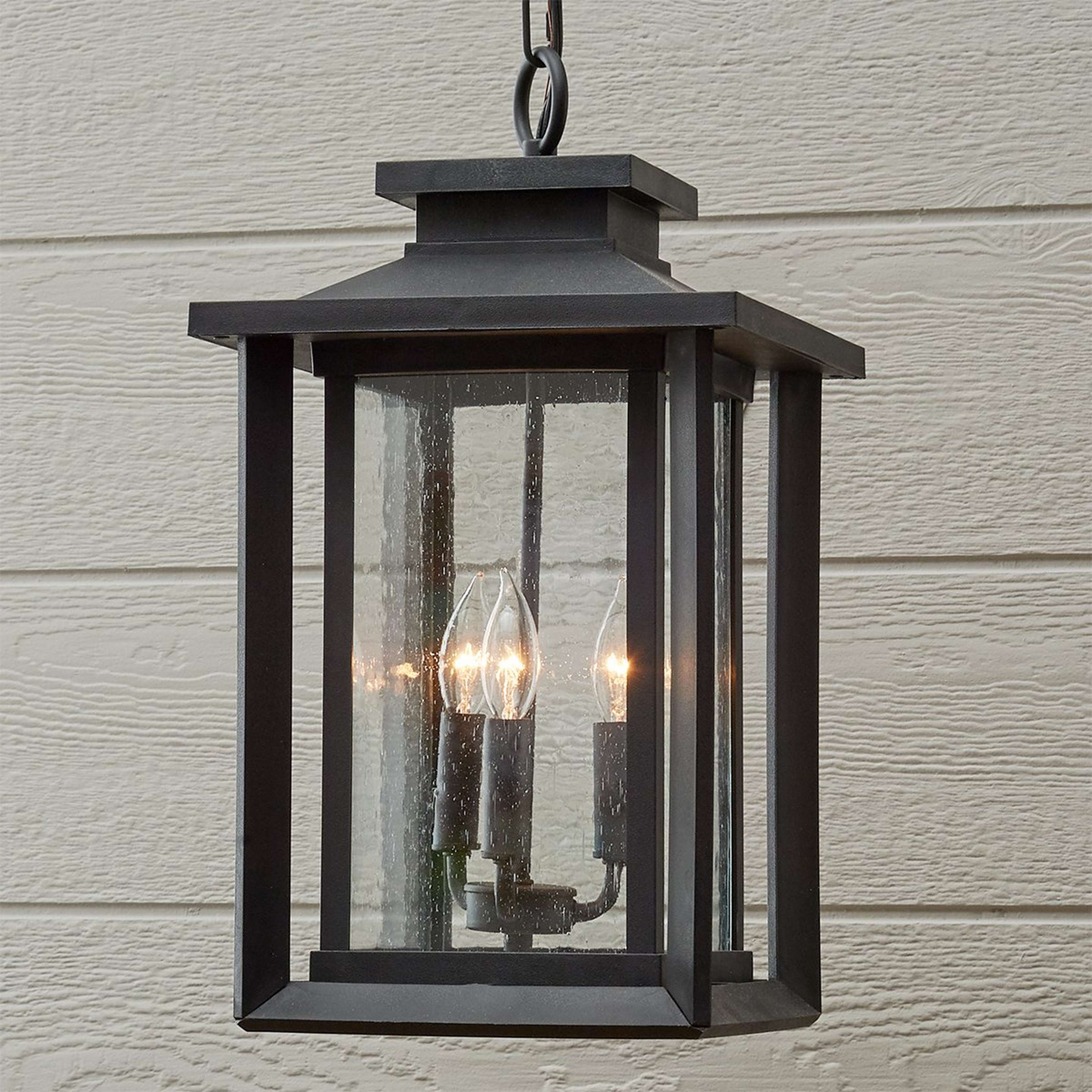 A Double Framed Outdoor Lantern with Black / Seedy Glass color
