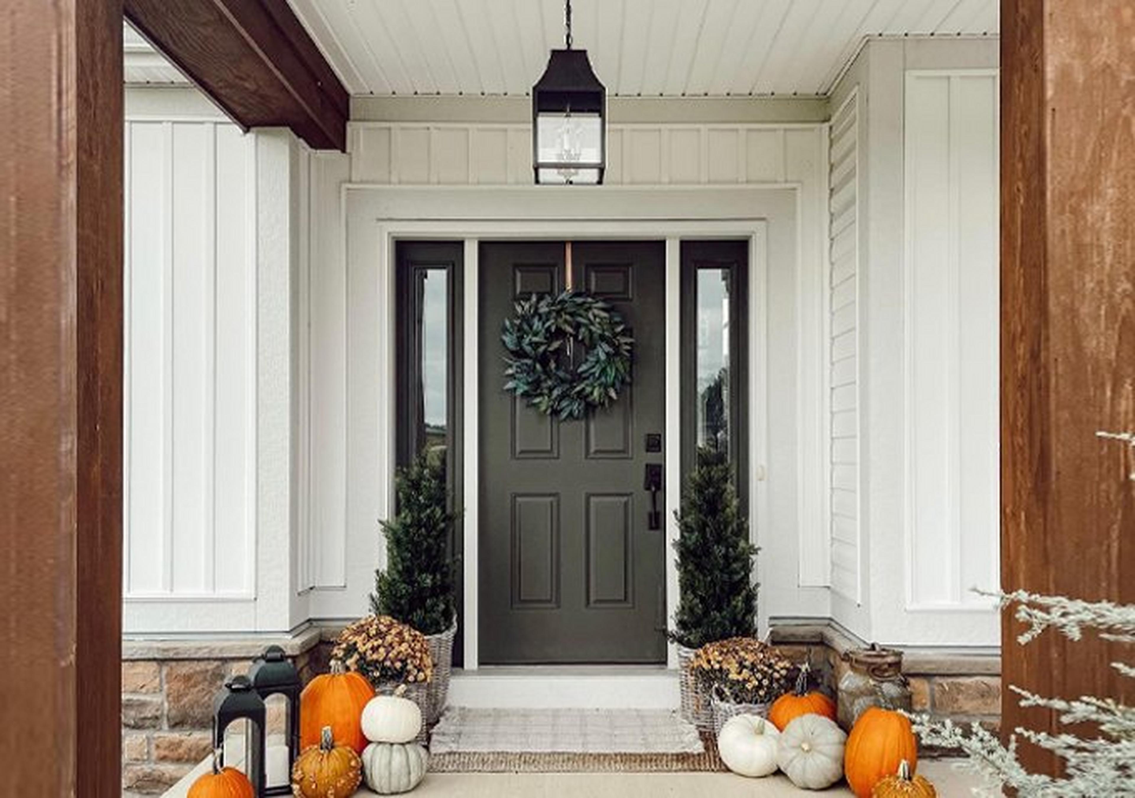 Colonial Metalcrafts Capital Outdoor Lantern on a fall porch