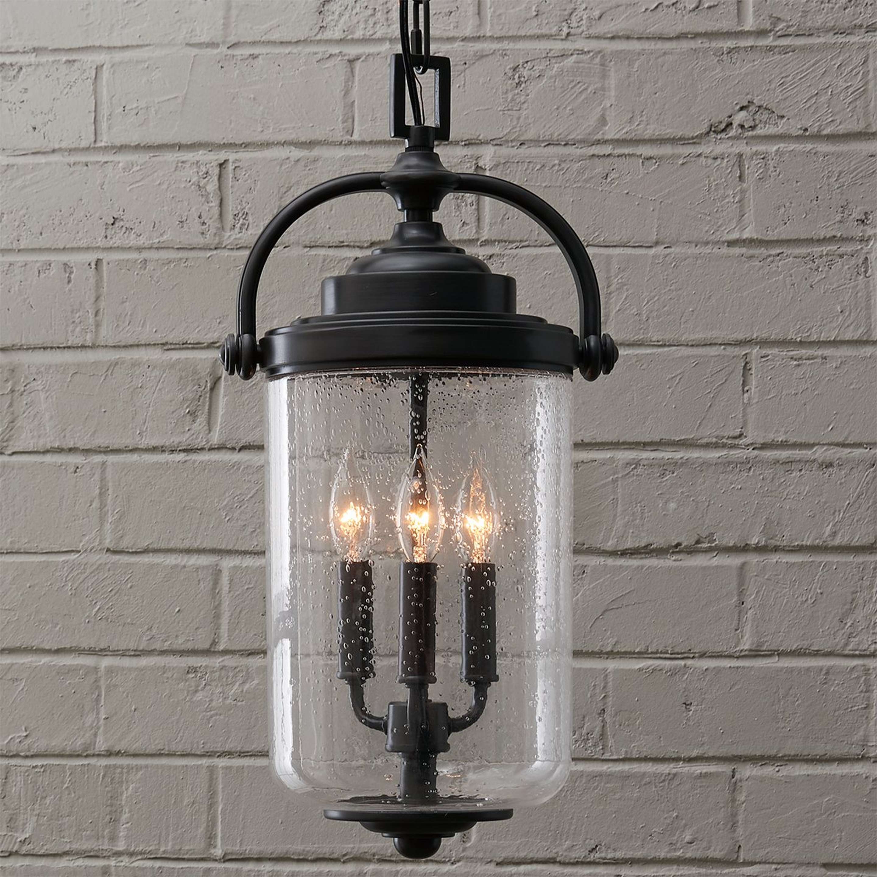 A Jacksonville Hanging Outdoor Lantern with Oil Rubbed Bronze / Seedy Glass color