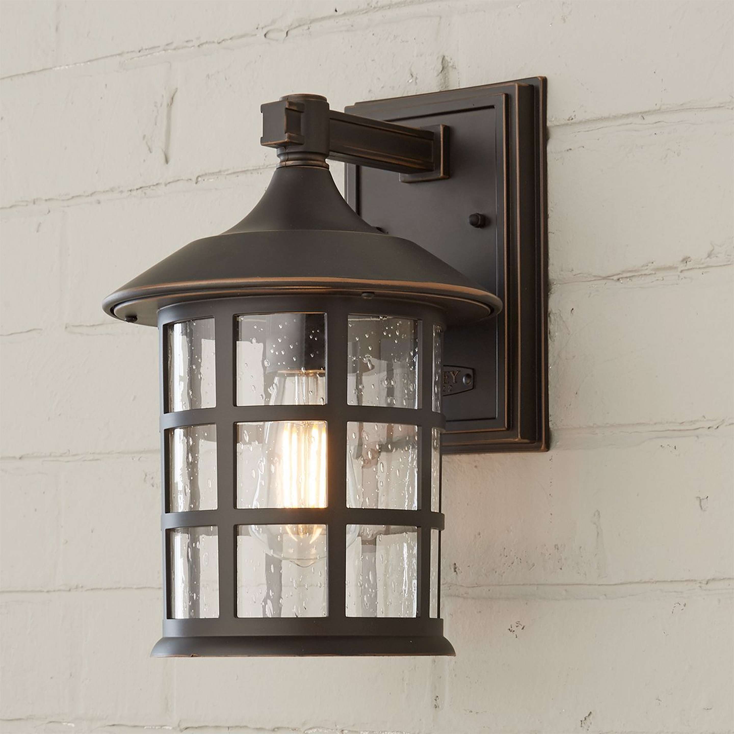 A Bar Harbor Outdoor Sconce - Medium with Oil Rubbed Bronze / Seedy Glass color