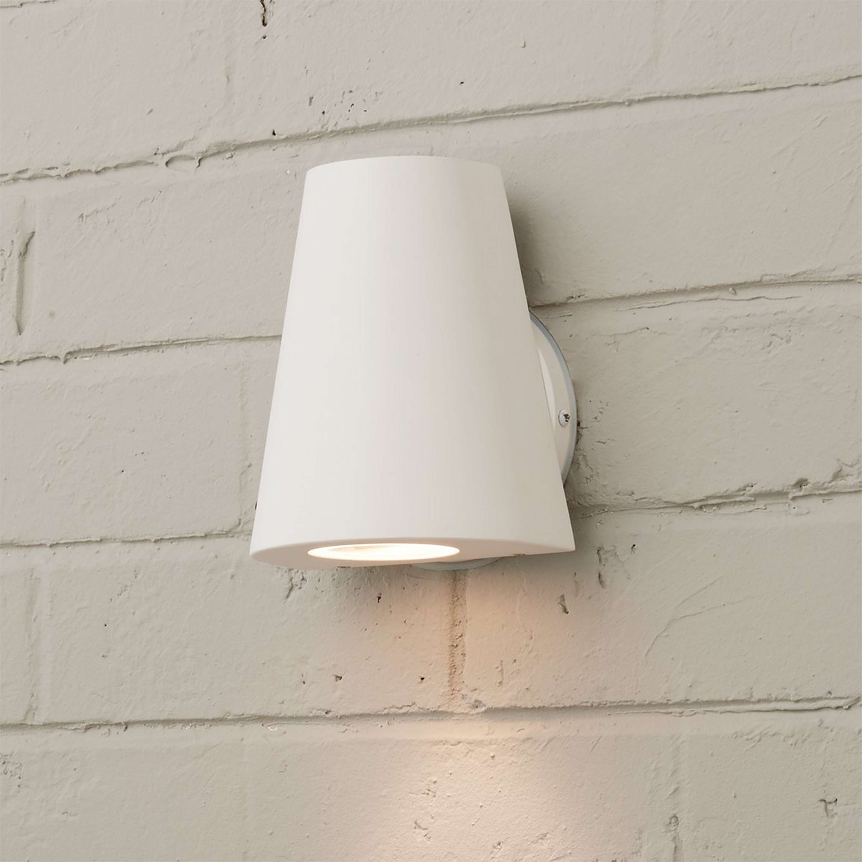 A Tapered Top Outdoor Wall Sconce with White color