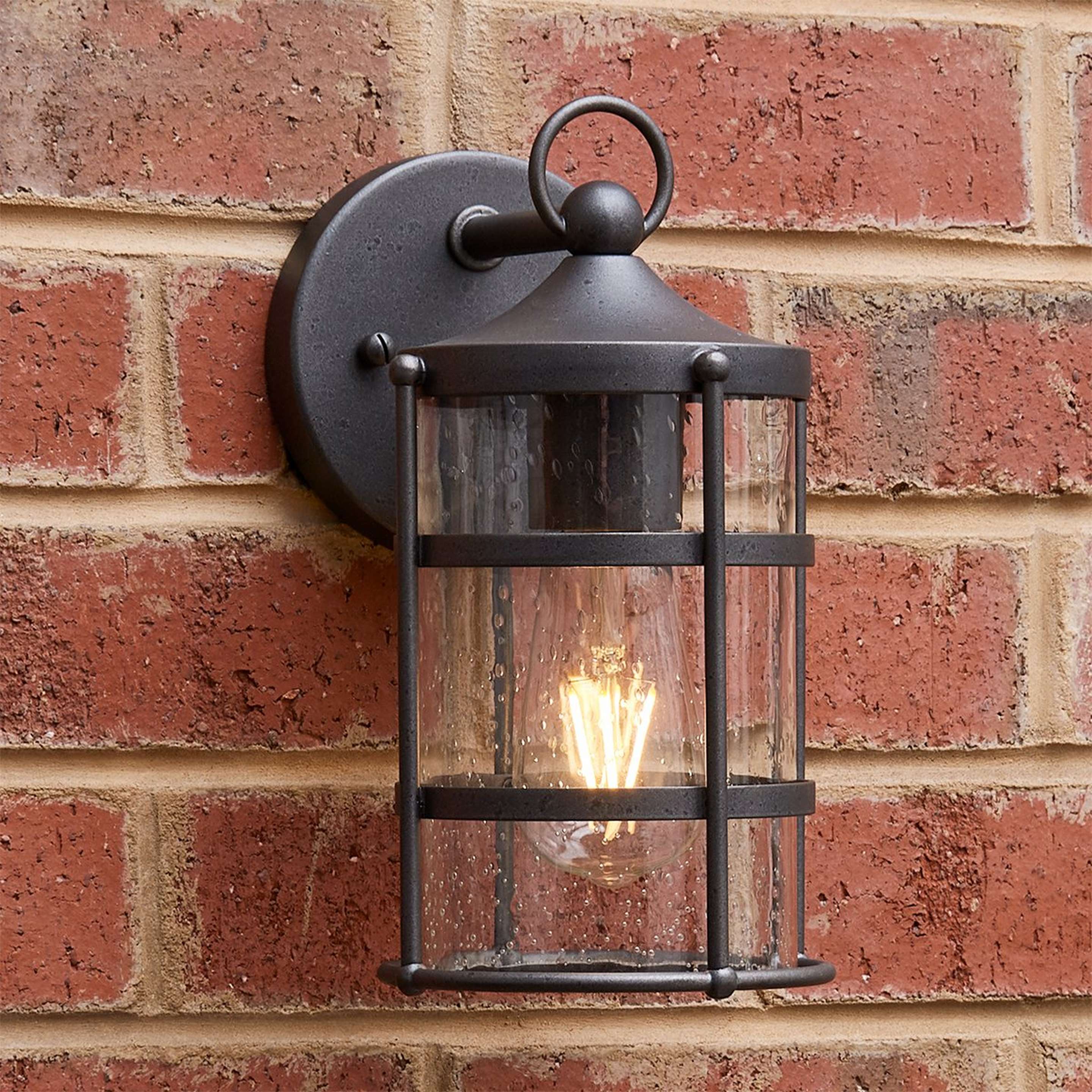 A Amell Outdoor Sconce with Iron / Seedy Glass color