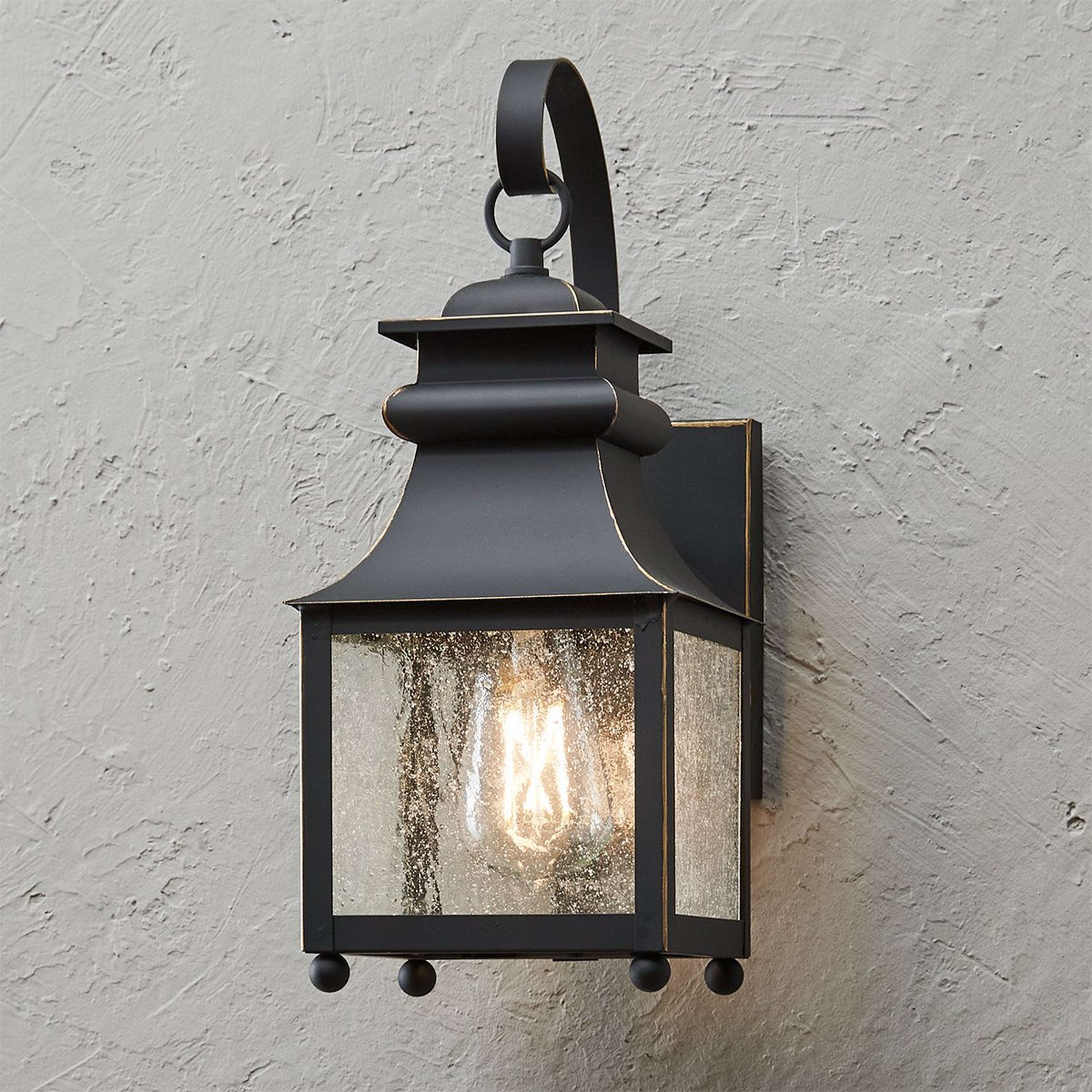 A Homesteader Seeded Glass Outdoor Sconce - 1 Light with Weathered Bronze / Seedy Glass color