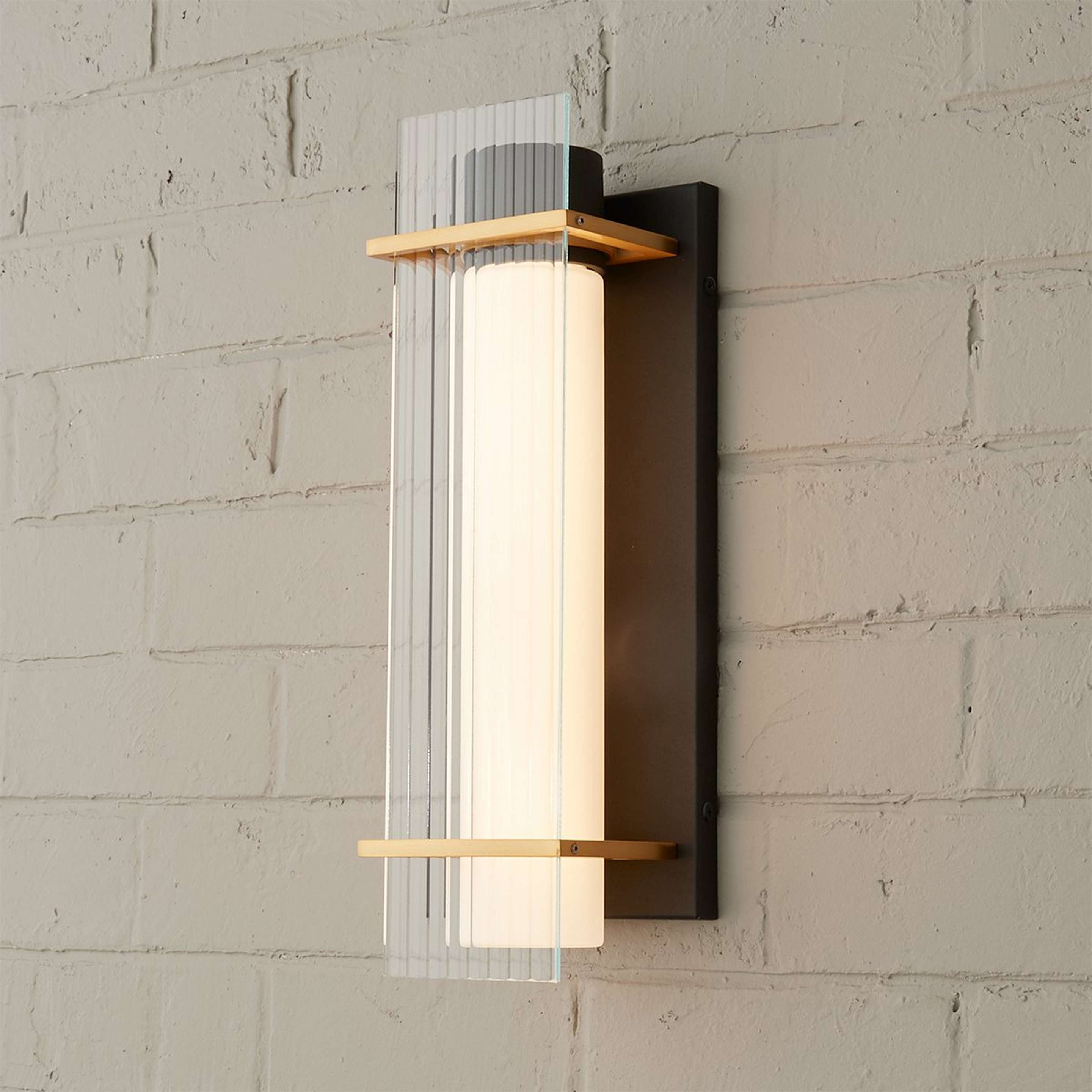A Bodie LED Outdoor Sconce with Black / Gold / Etched Glass color