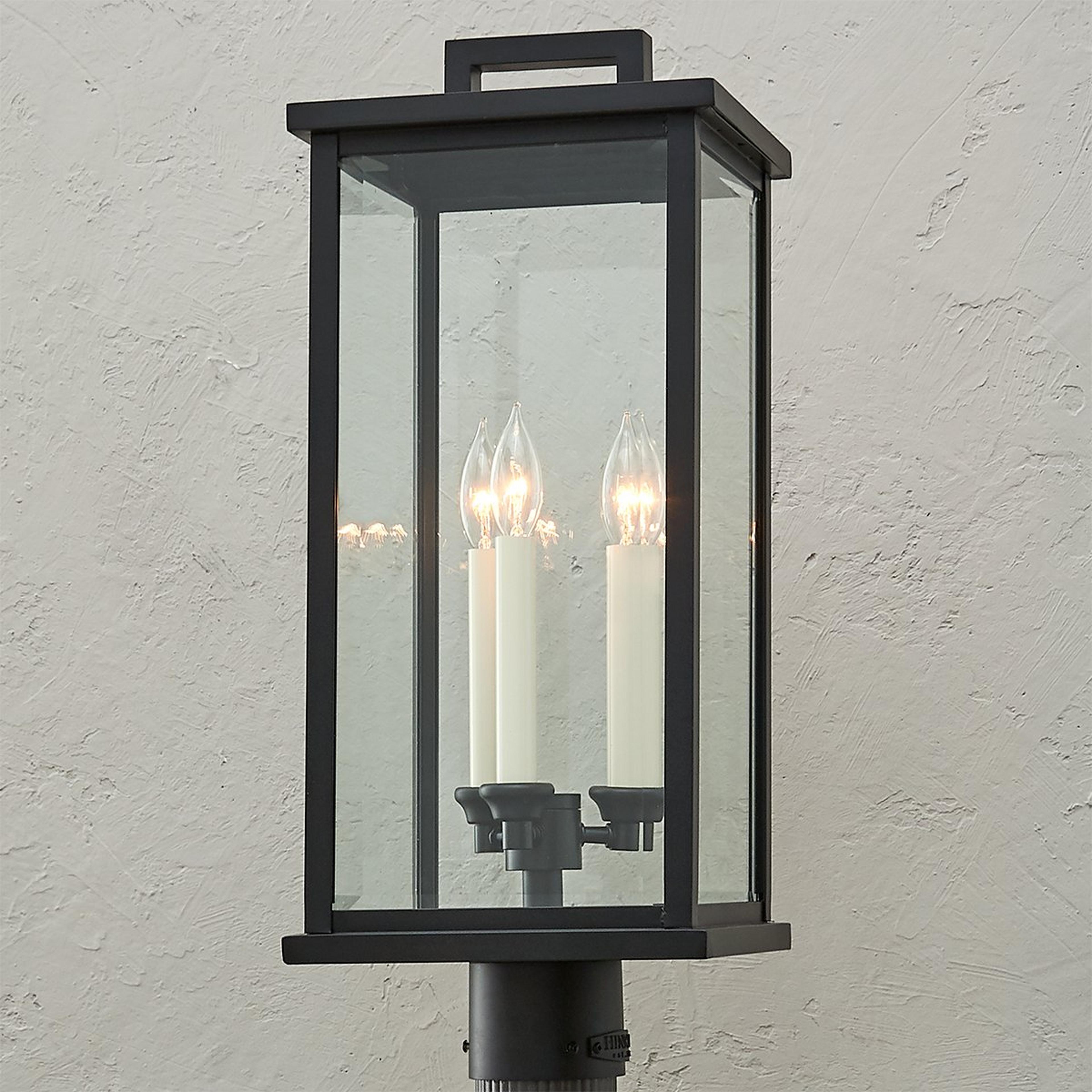 A Carrington Outdoor Post Light with Black / Clear Beveled Glass color