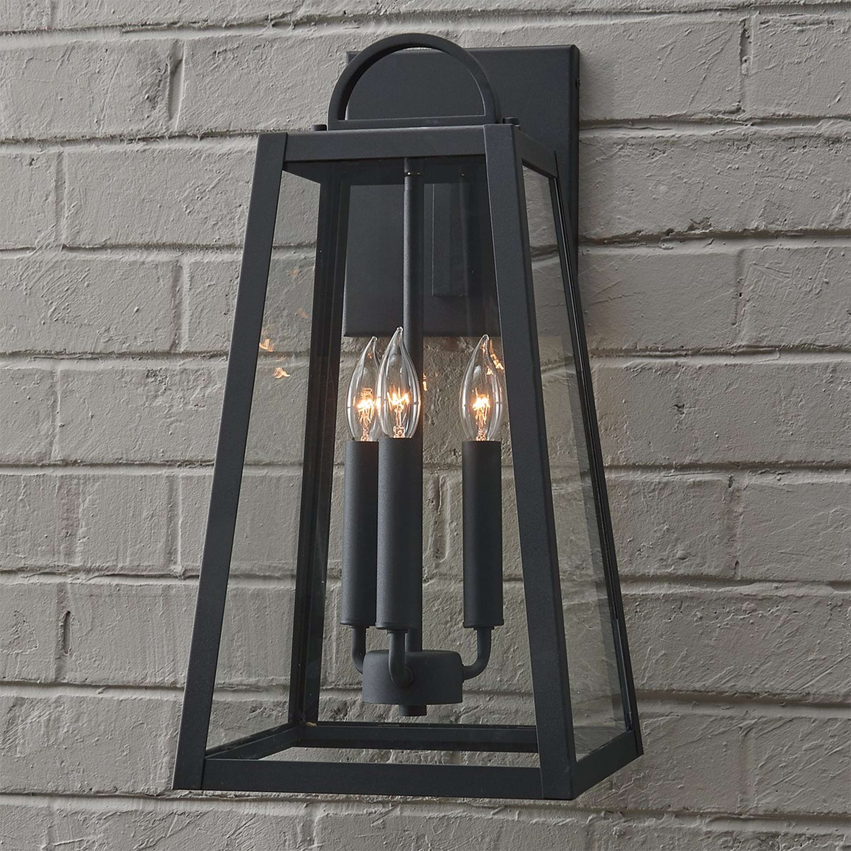 A Classic Ilona Outdoor Sconce - Medium with Black / Clear Glass color
