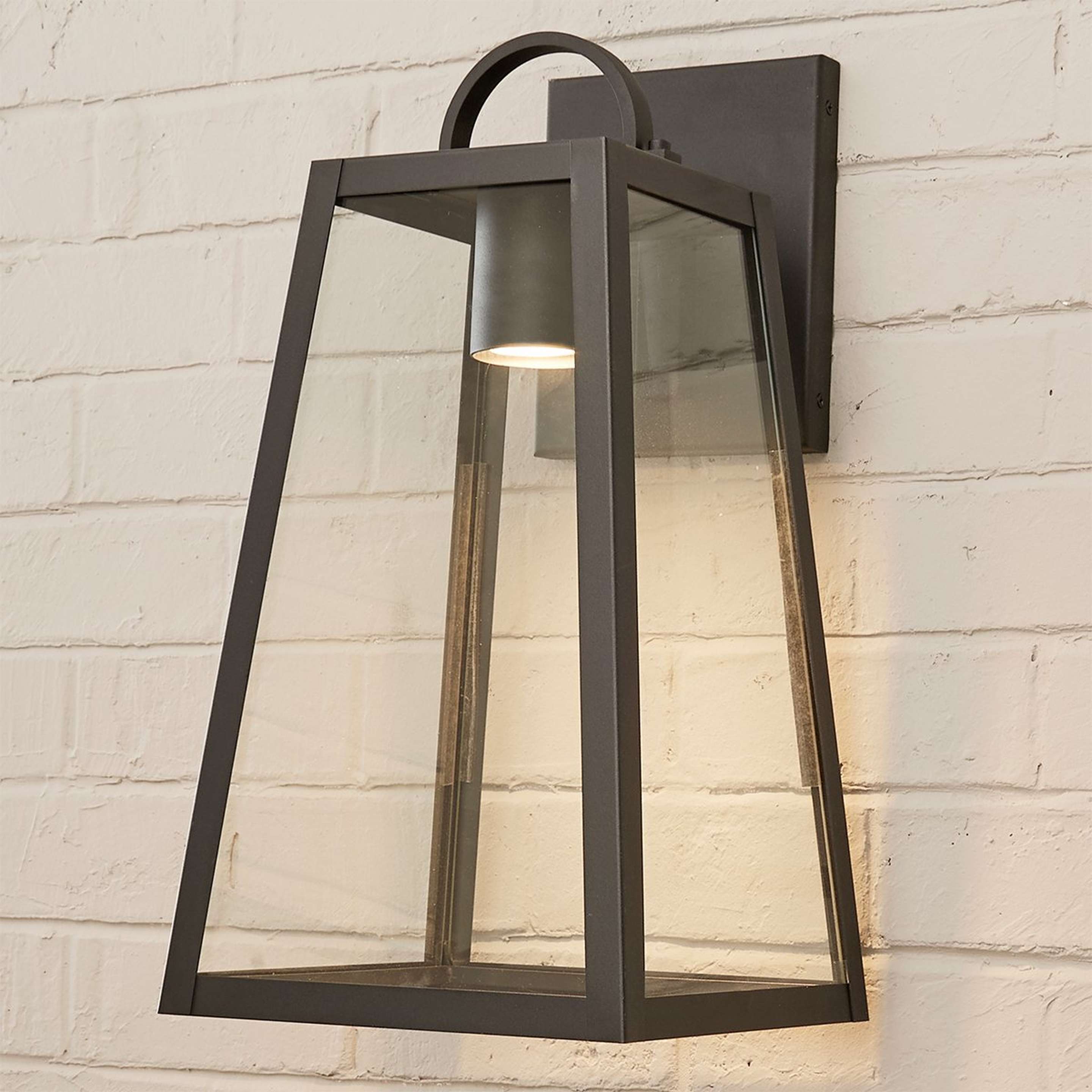 A Modern Ilona Outdoor Sconce - Medium with Black / Clear Glass color