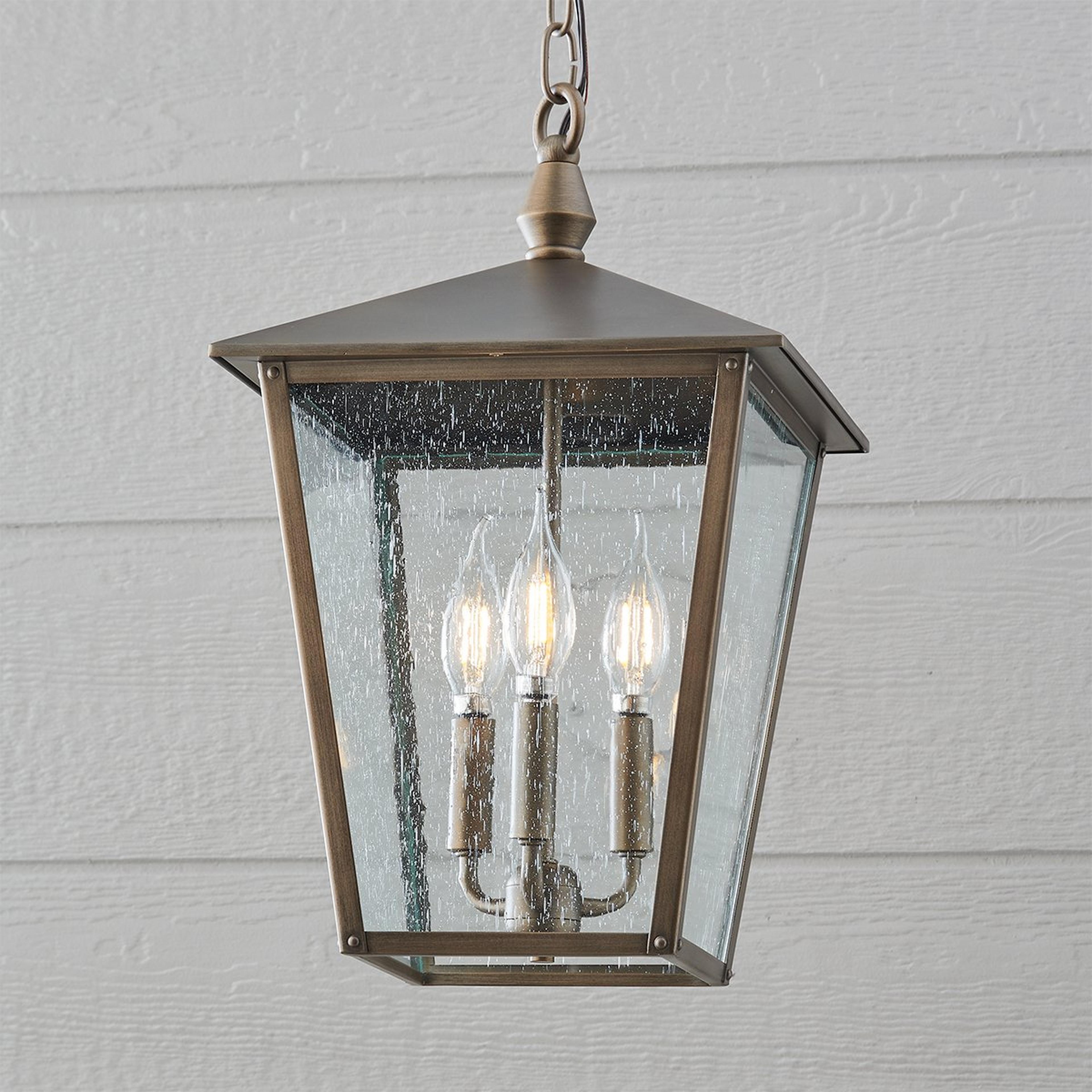A Classic Caroline Outdoor Hanging Lantern with Burnished Bronze / Seeded Glass color