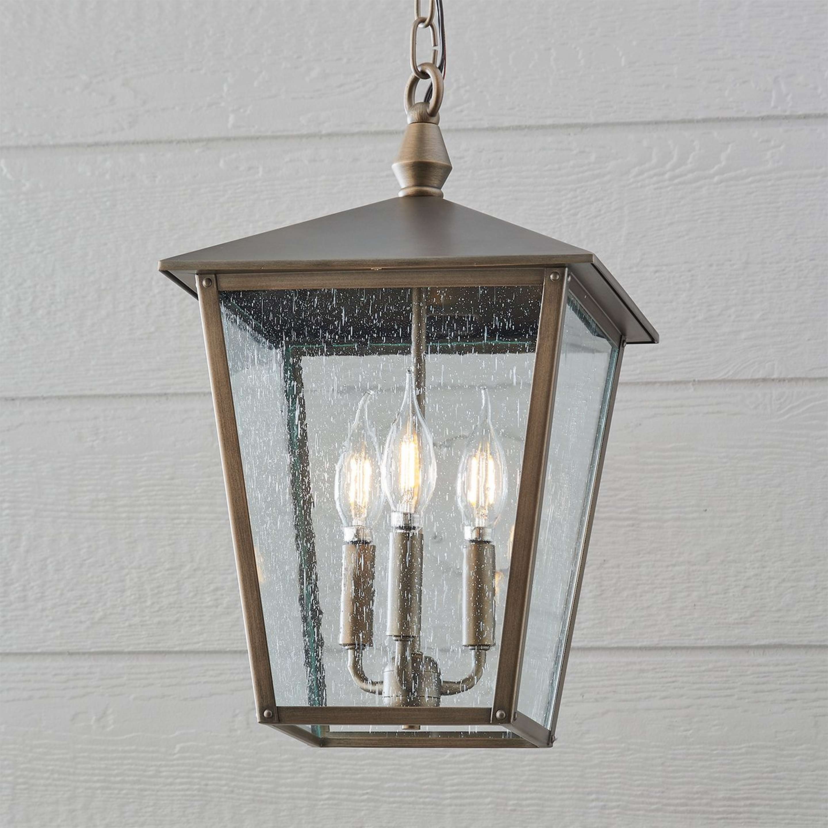 A Classic Caroline Outdoor Hanging Lantern with Burnished Bronze / Seeded Glass color