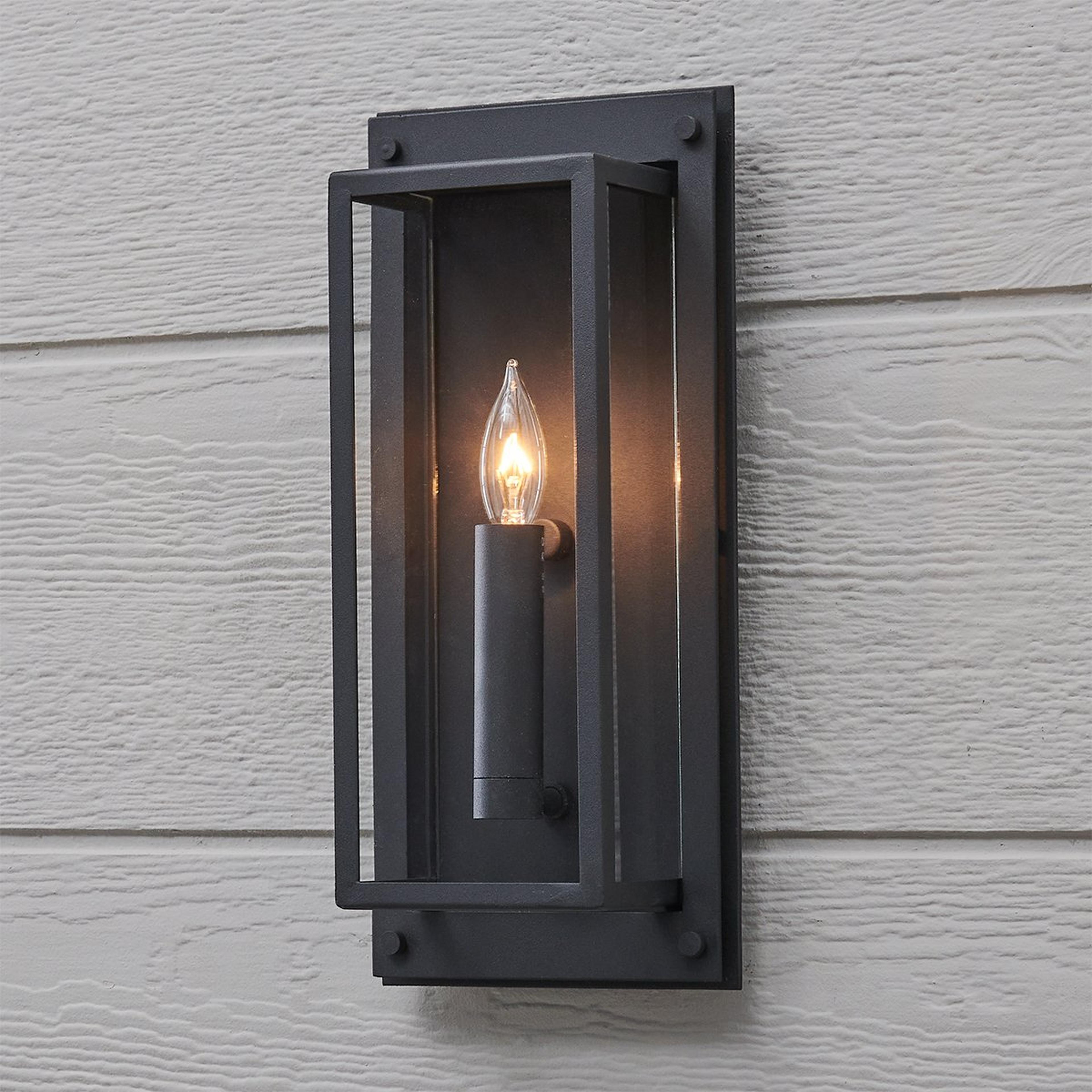 A Squarish Outdoor Sconce - 1 Light with Textured Black / Clear Glass color