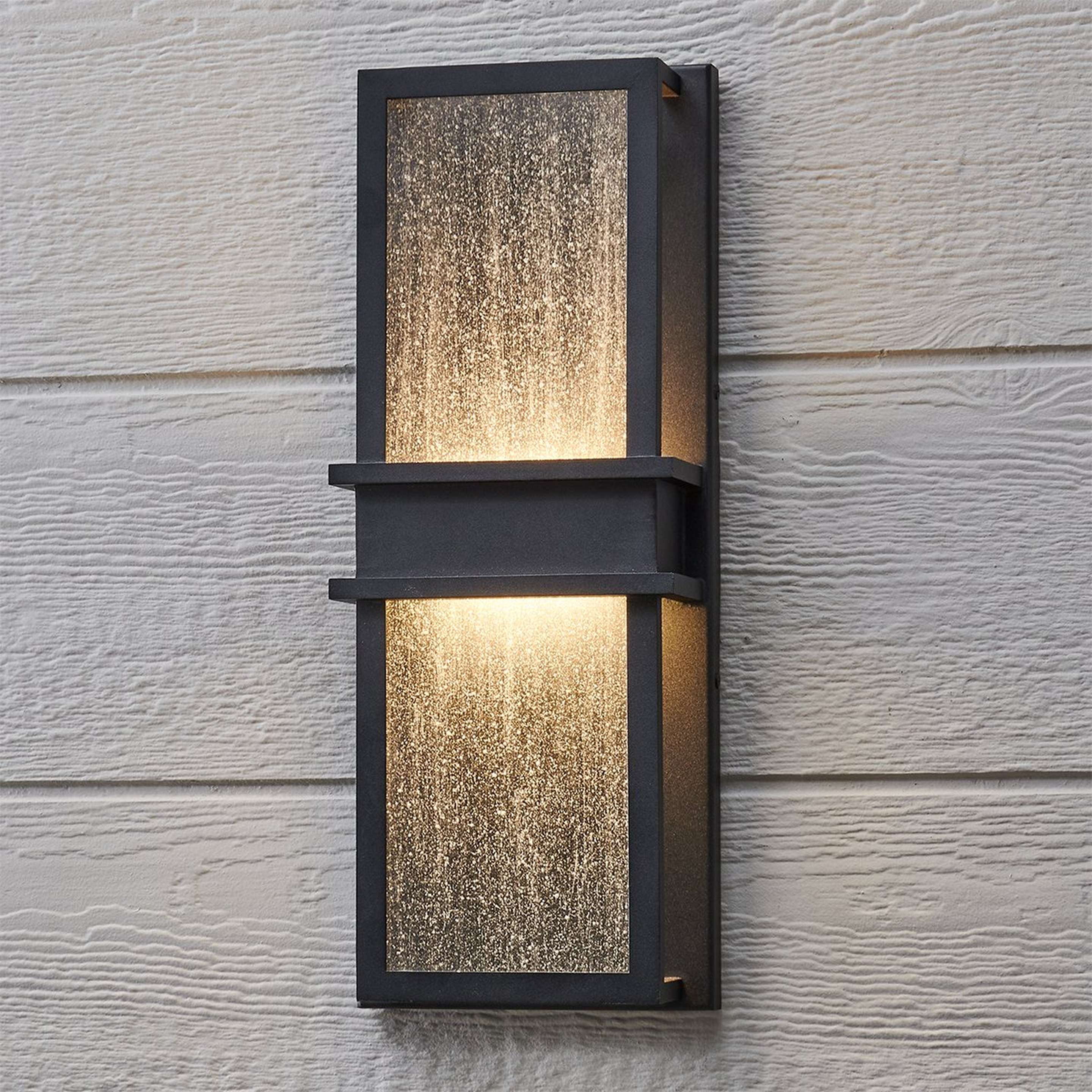 A Pencomb LED Outdoor Sconce - Medium with Black / Seeded Glass color