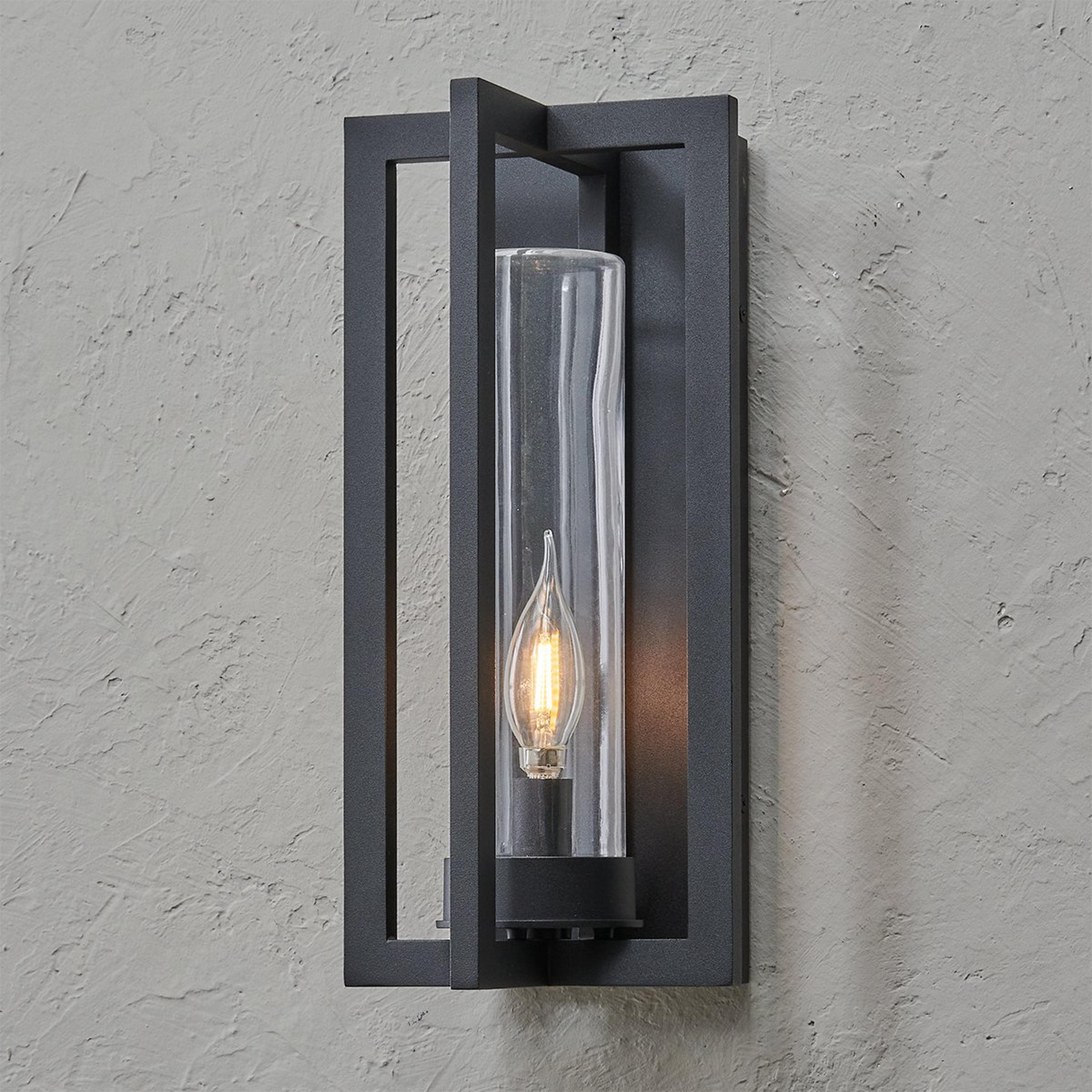 A Cahira Outdoor Sconce - Small with Textured Black / Clear Glass color