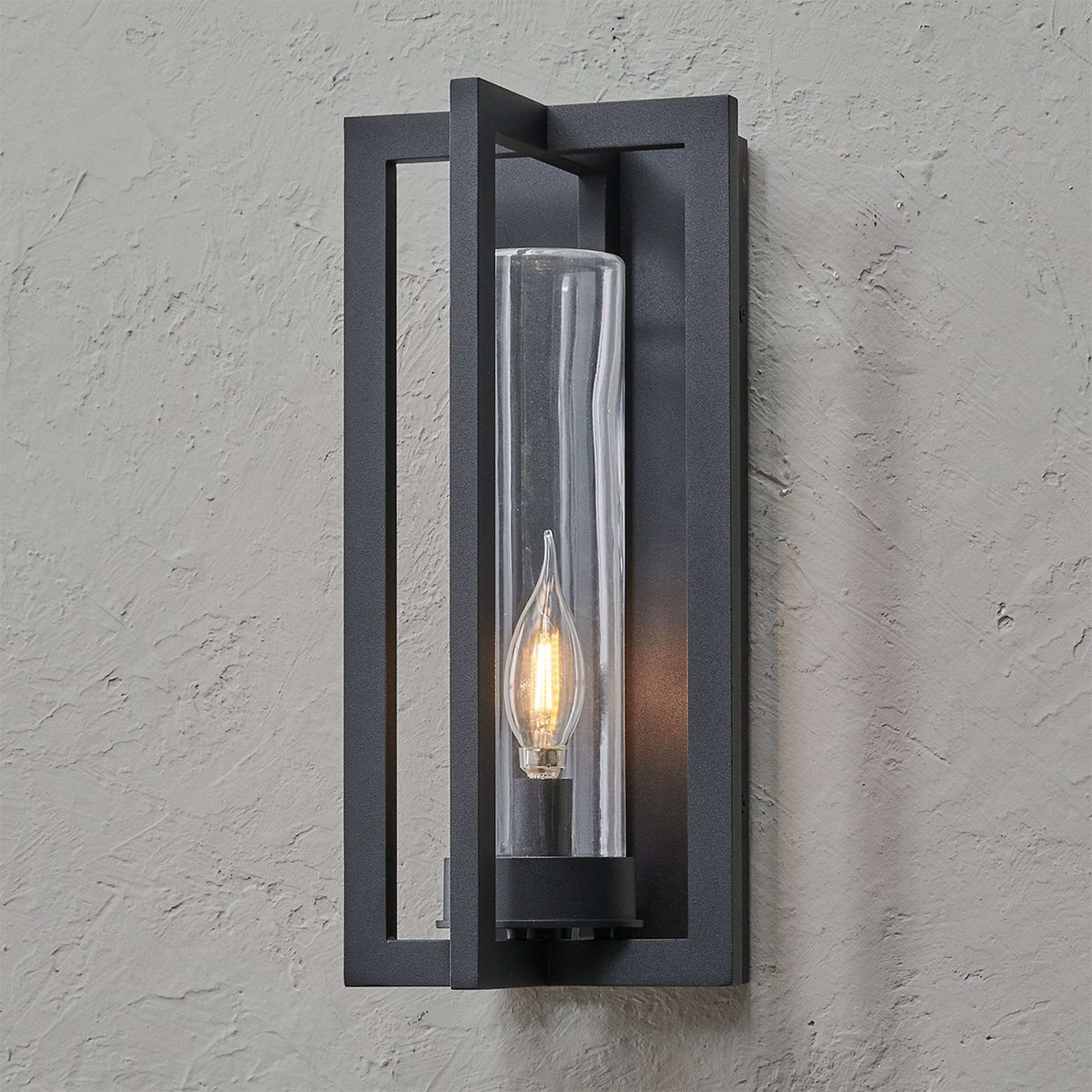 A Cahira Outdoor Sconce - Small with Textured Black / Clear Glass color