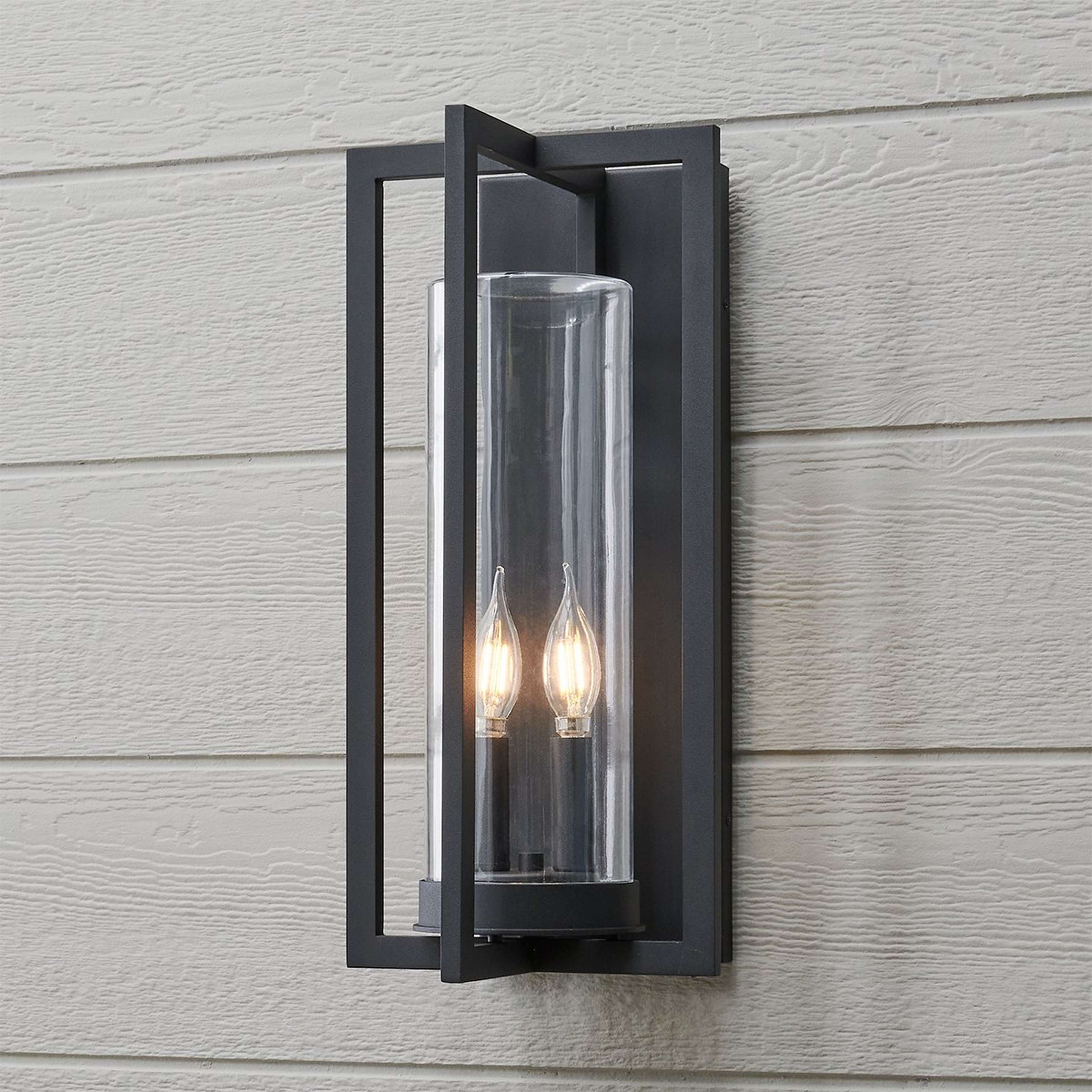 A Cahira Outdoor Sconce - Large with Textured Black / Clear Glass color