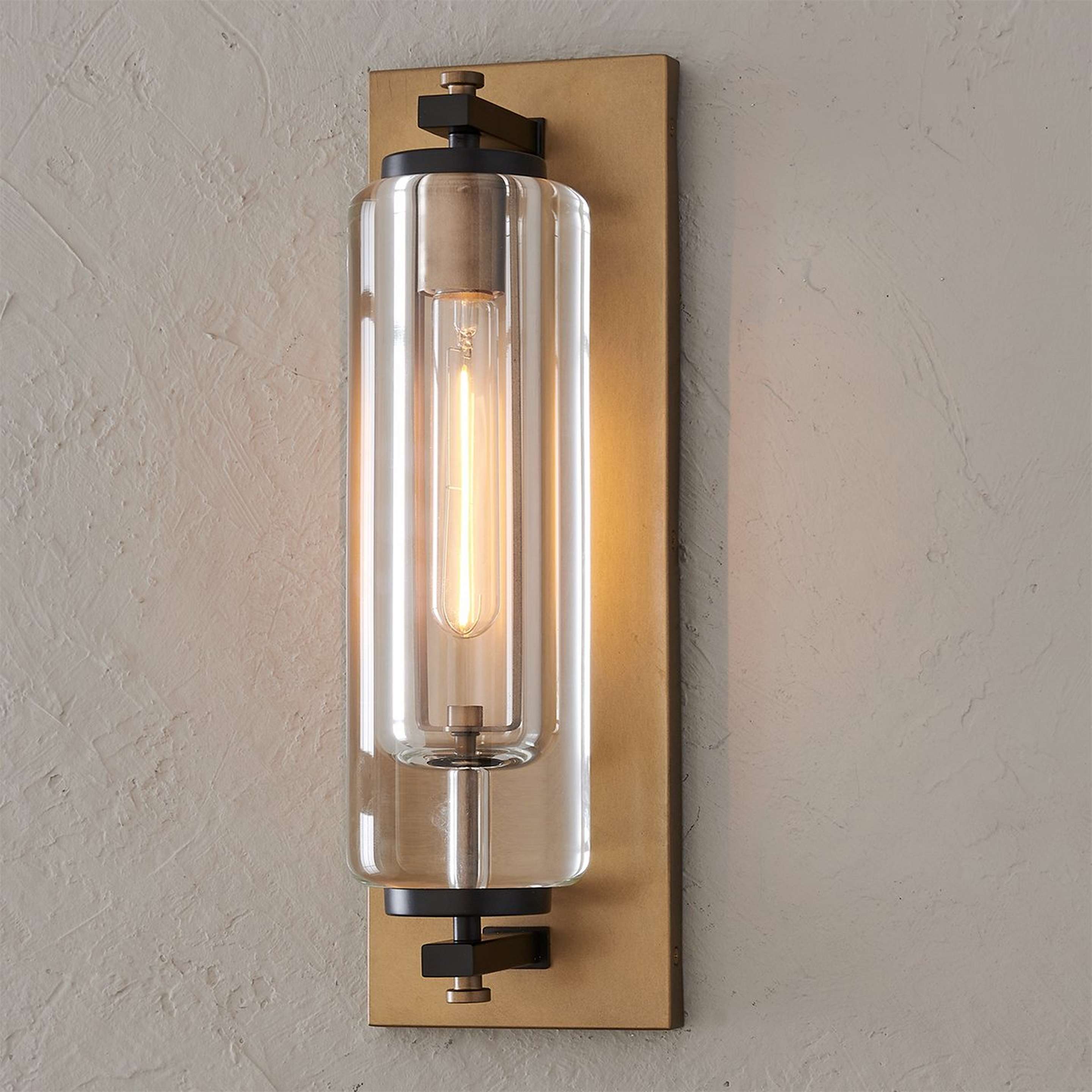 A Artifice Outdoor Sconce with Aged Brass / Black / Clear Glass color
