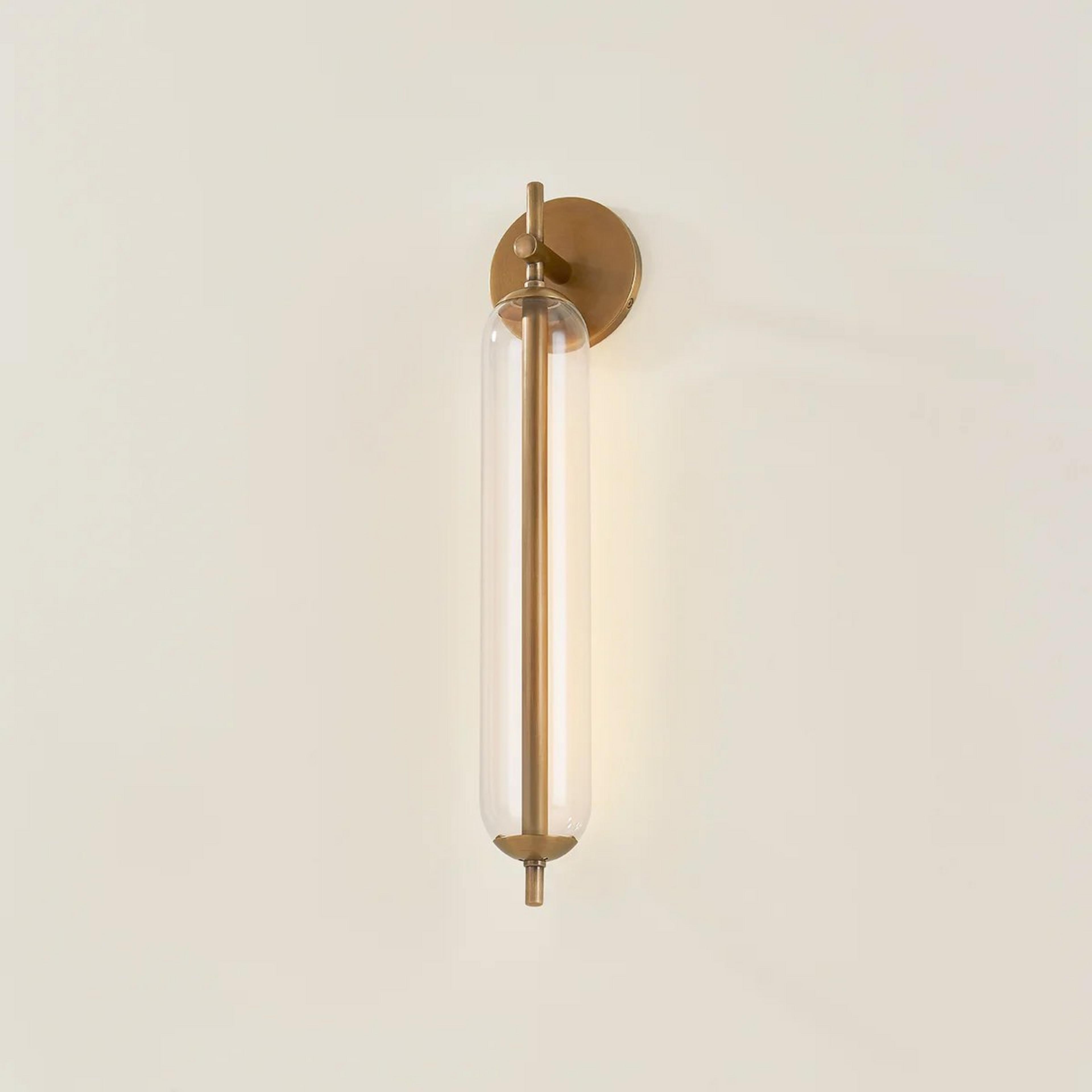 A Photinia Outdoor LED Sconce - 22" with Brass / Clear Glass color