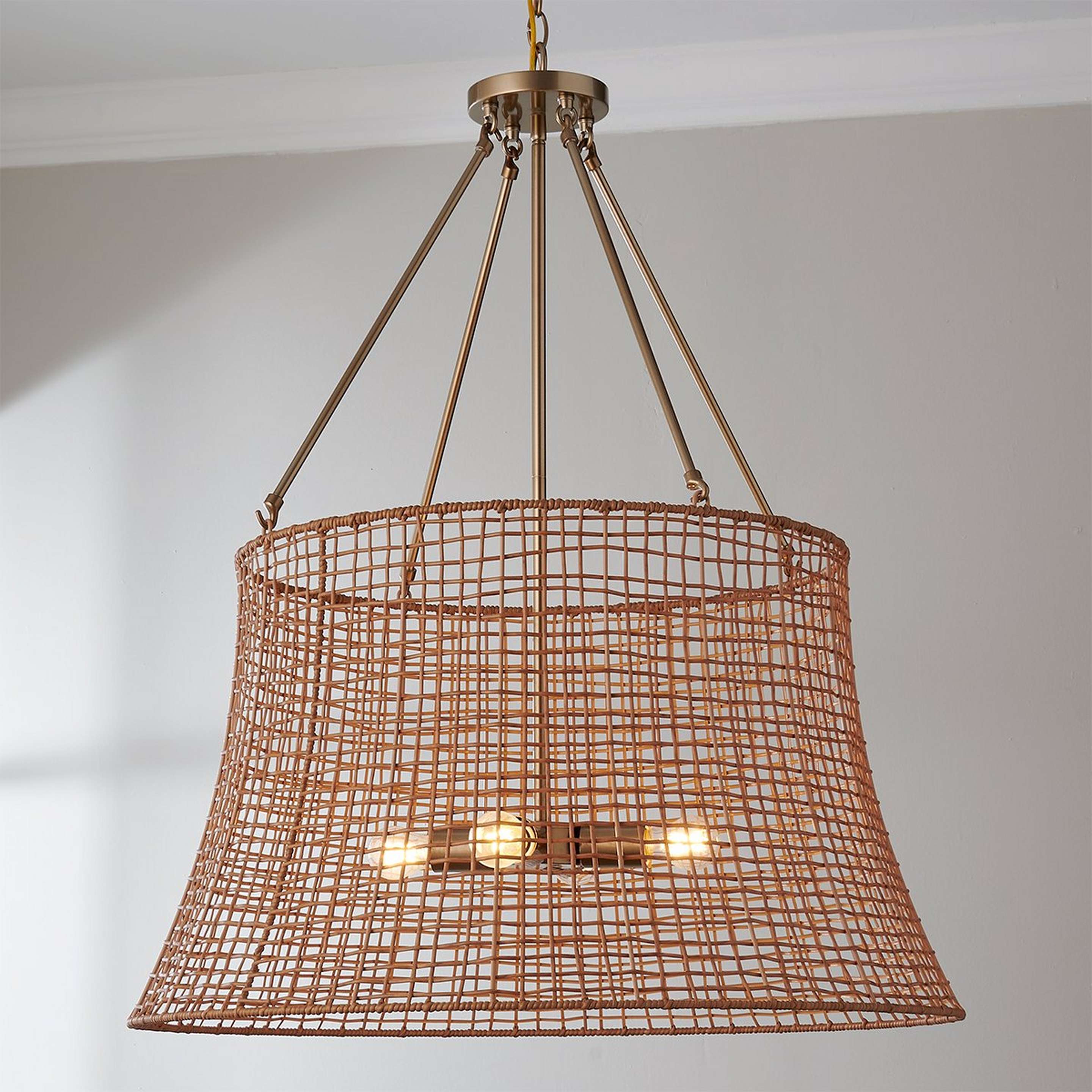 A Christelle Outdoor Lantern with Burnished Brass / Natural Rattan color