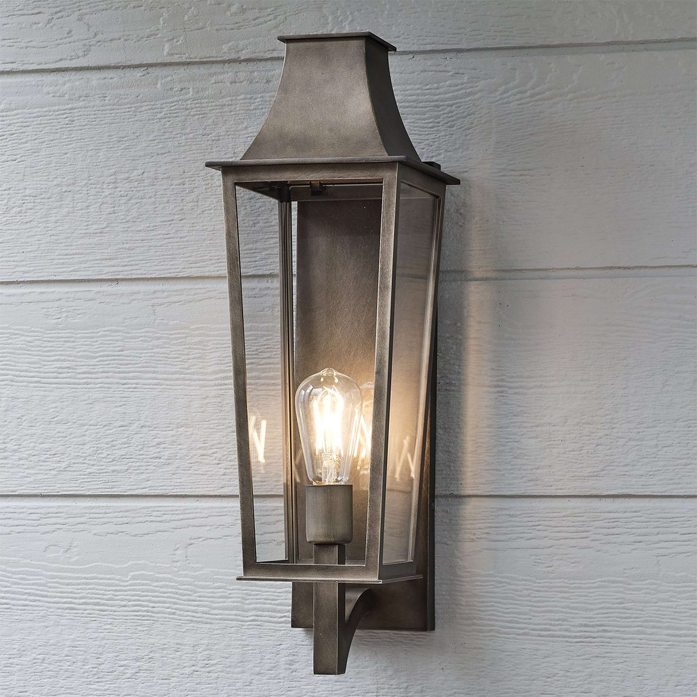 A Sarasota Outdoor Sconce - Medium with Bronze / Clear Glass color