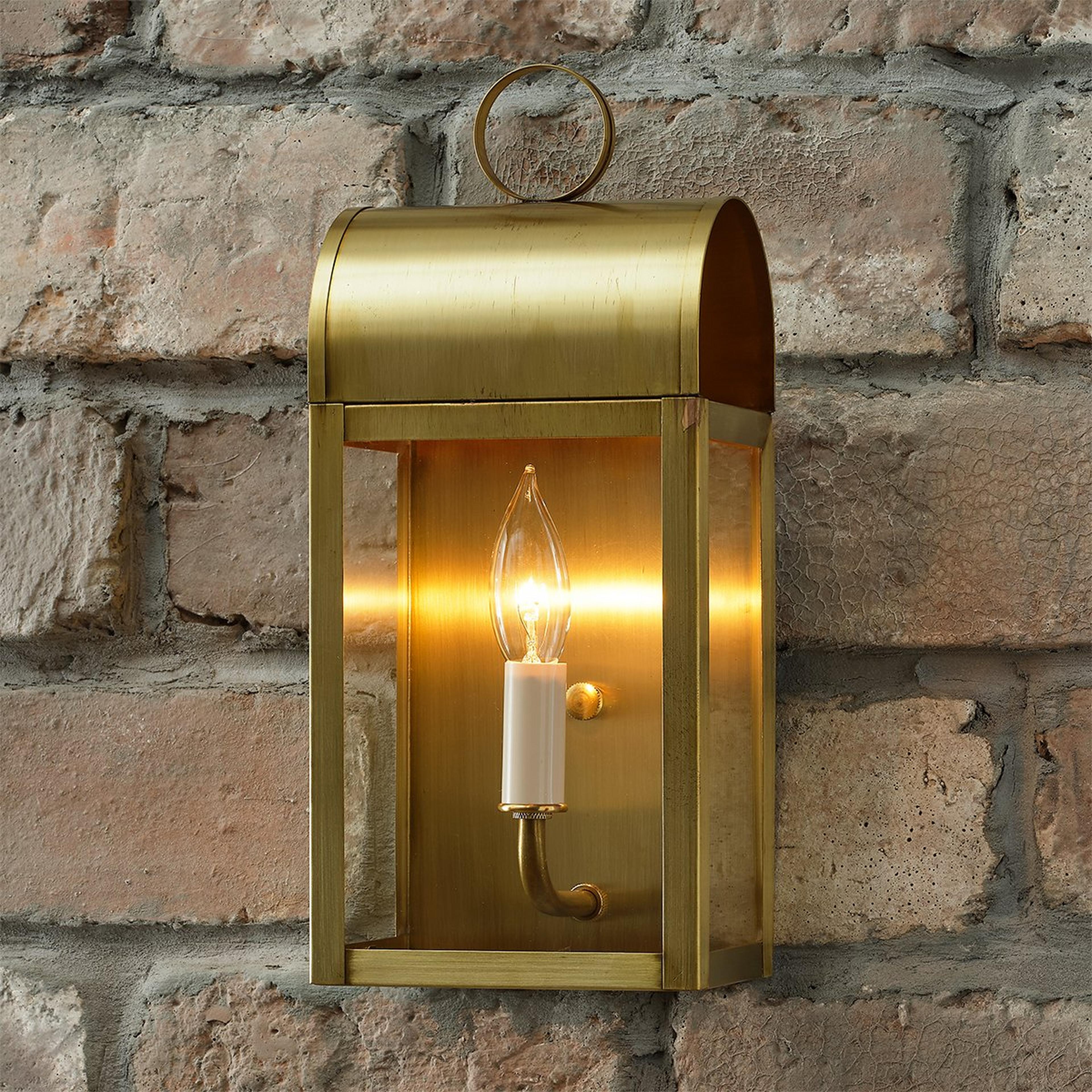 A Colonial Metalcrafts Arched Outdoor Sconce - Small with Brushed Brass / Clear Glass with Clear Coat color