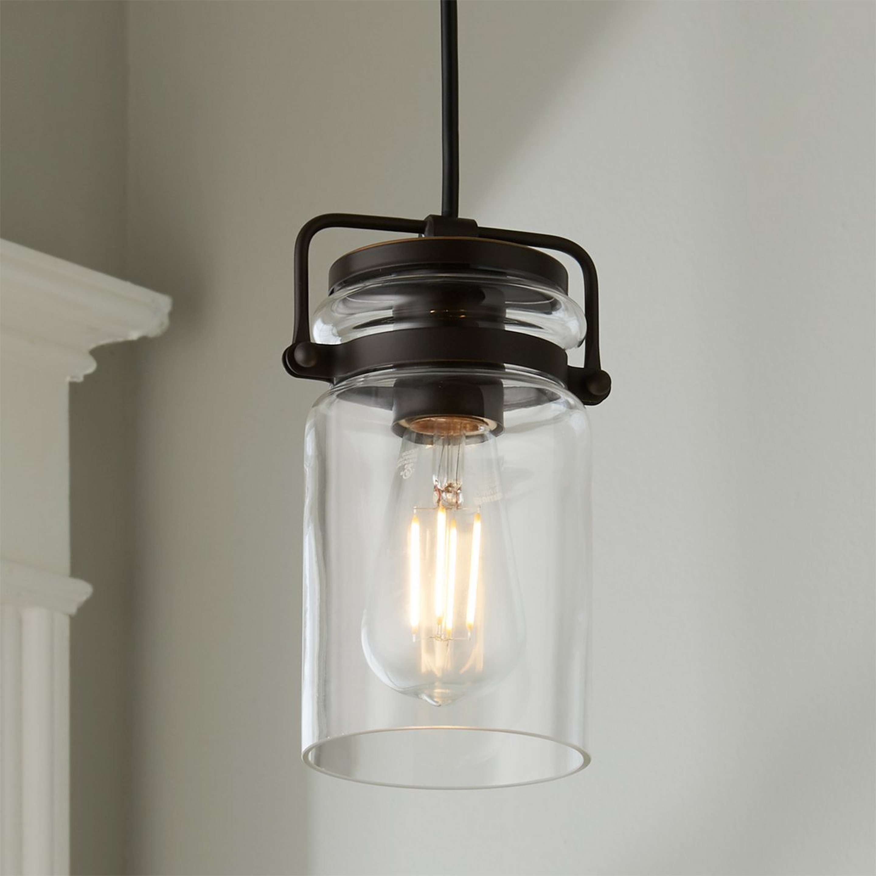 A Modern Mason Jar Pendant Light with Bronze color
