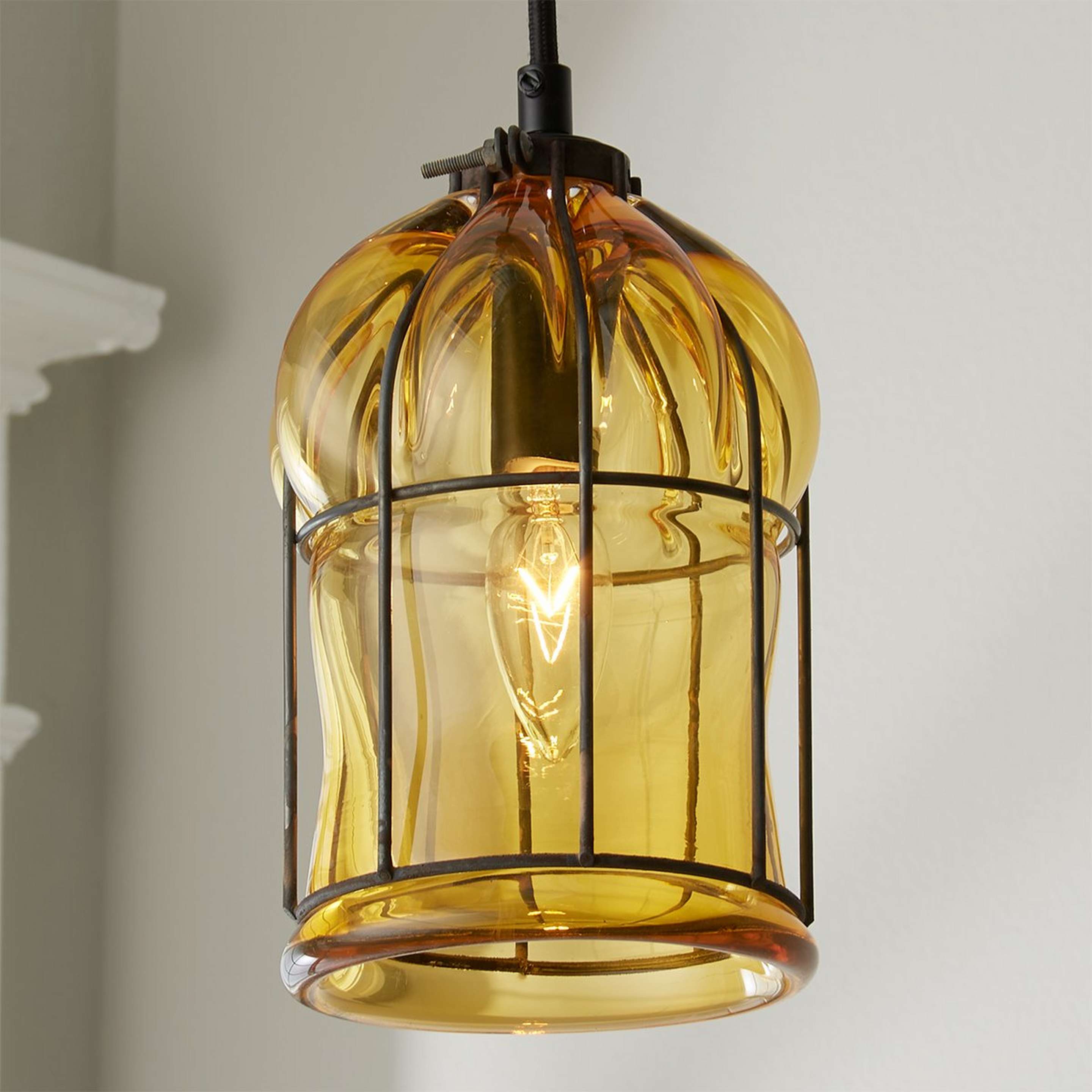 A Wendy Umanoff Glass Cage Pendant with Black / Amber color