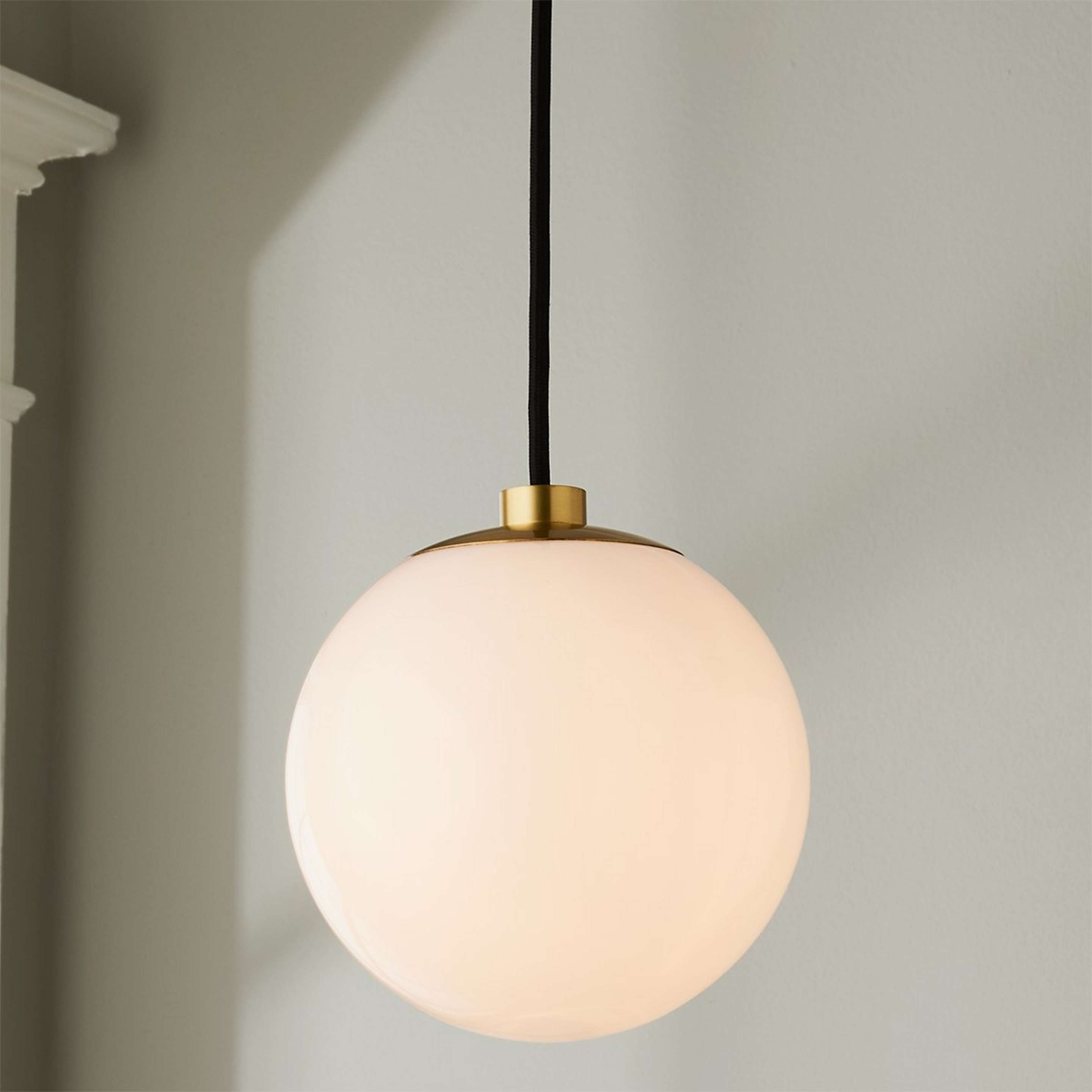 A Minimalist Globe Pendant with Satin Brass color