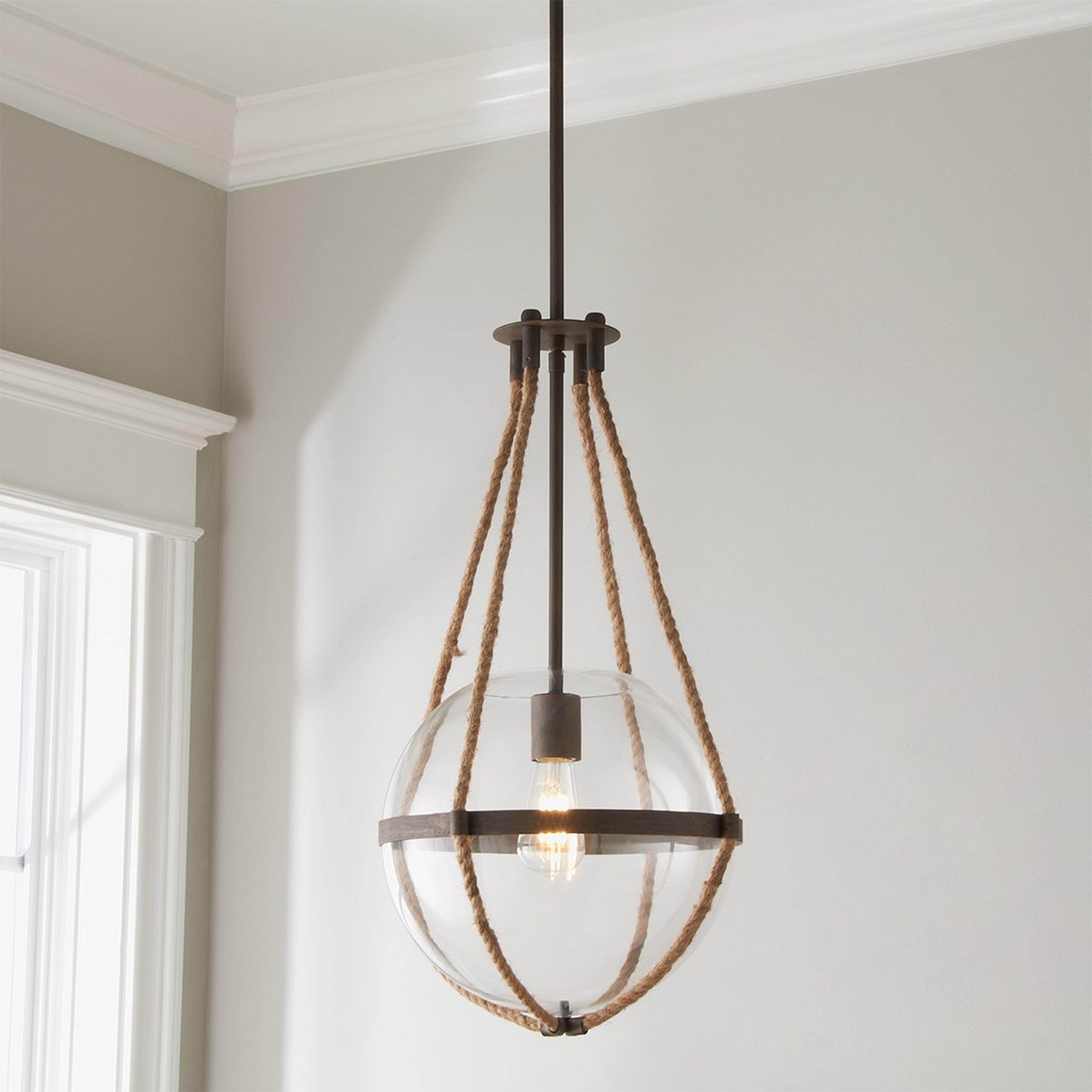 A Coastal Cottage Rope Globe Pendant with Distressed Warm Bronze color