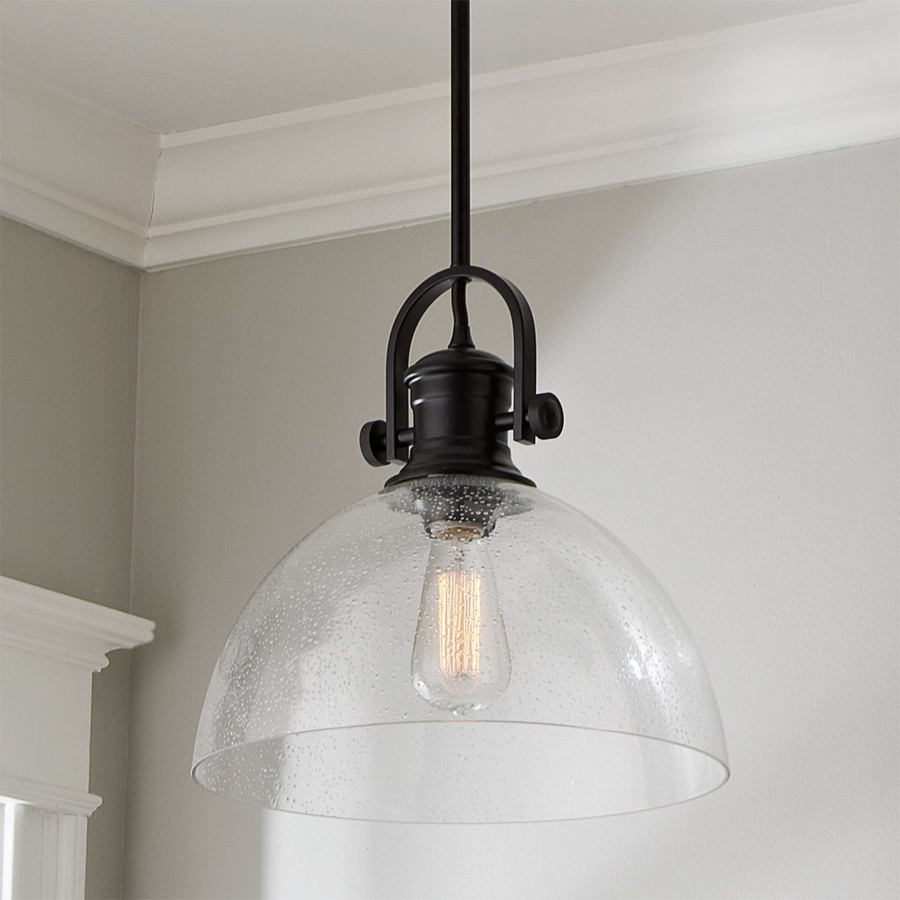 A Gwynn Isle Dome Pendant with Black / Clear Seeded Glass color