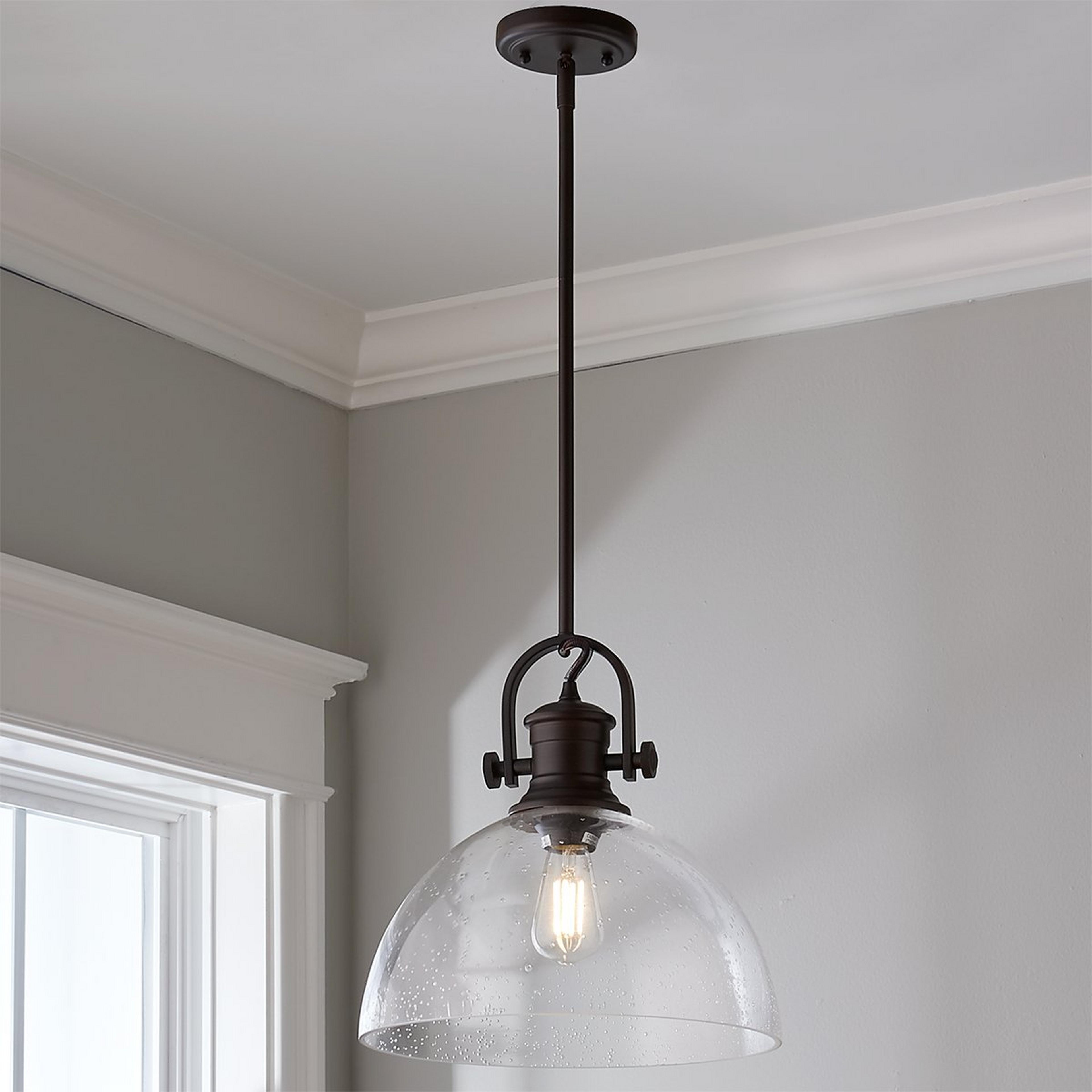 A Gwynn Isle Dome Pendant with Bronze / Clear Seedy Glass color