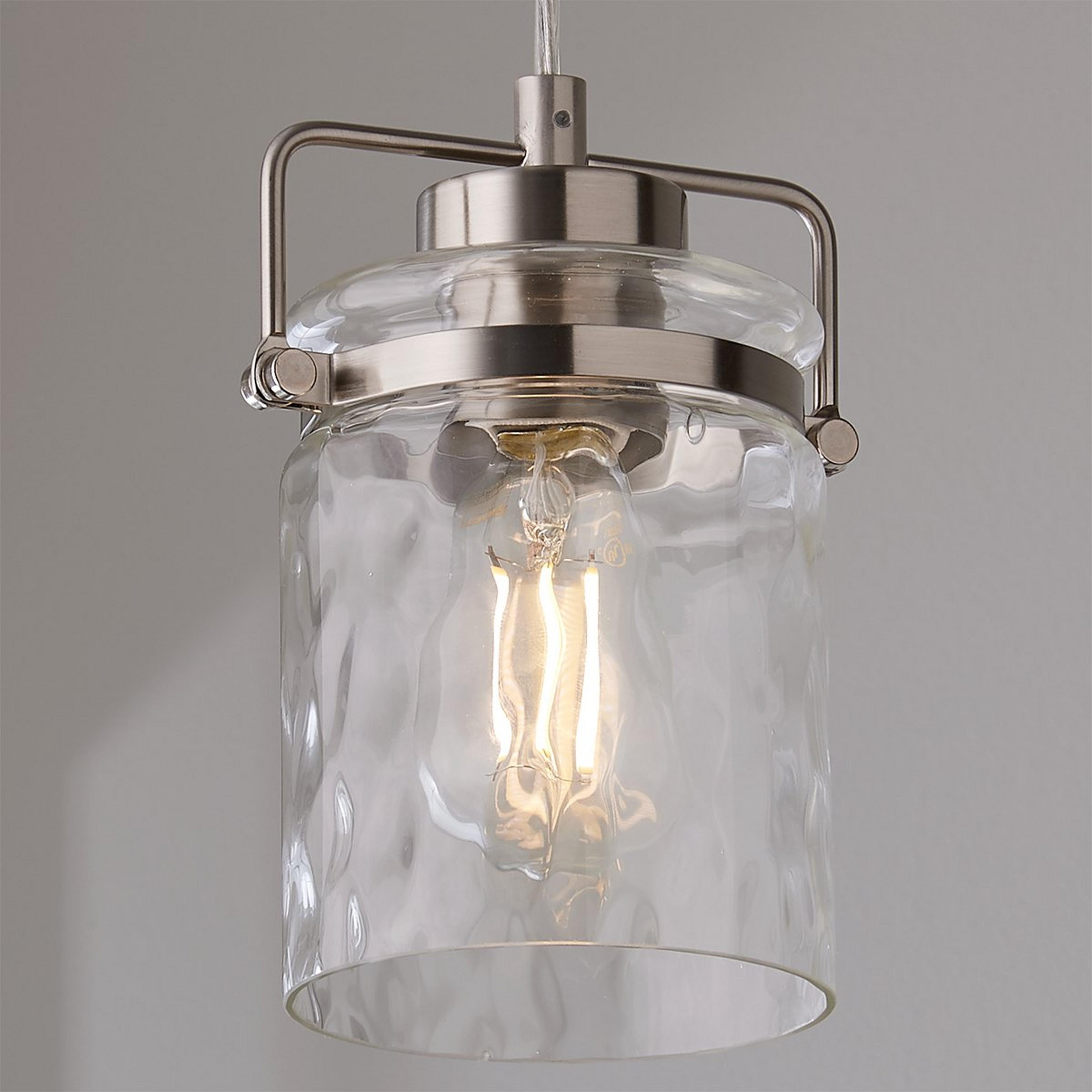 A Looped Water Glass Pendant with Brushed Nickel color