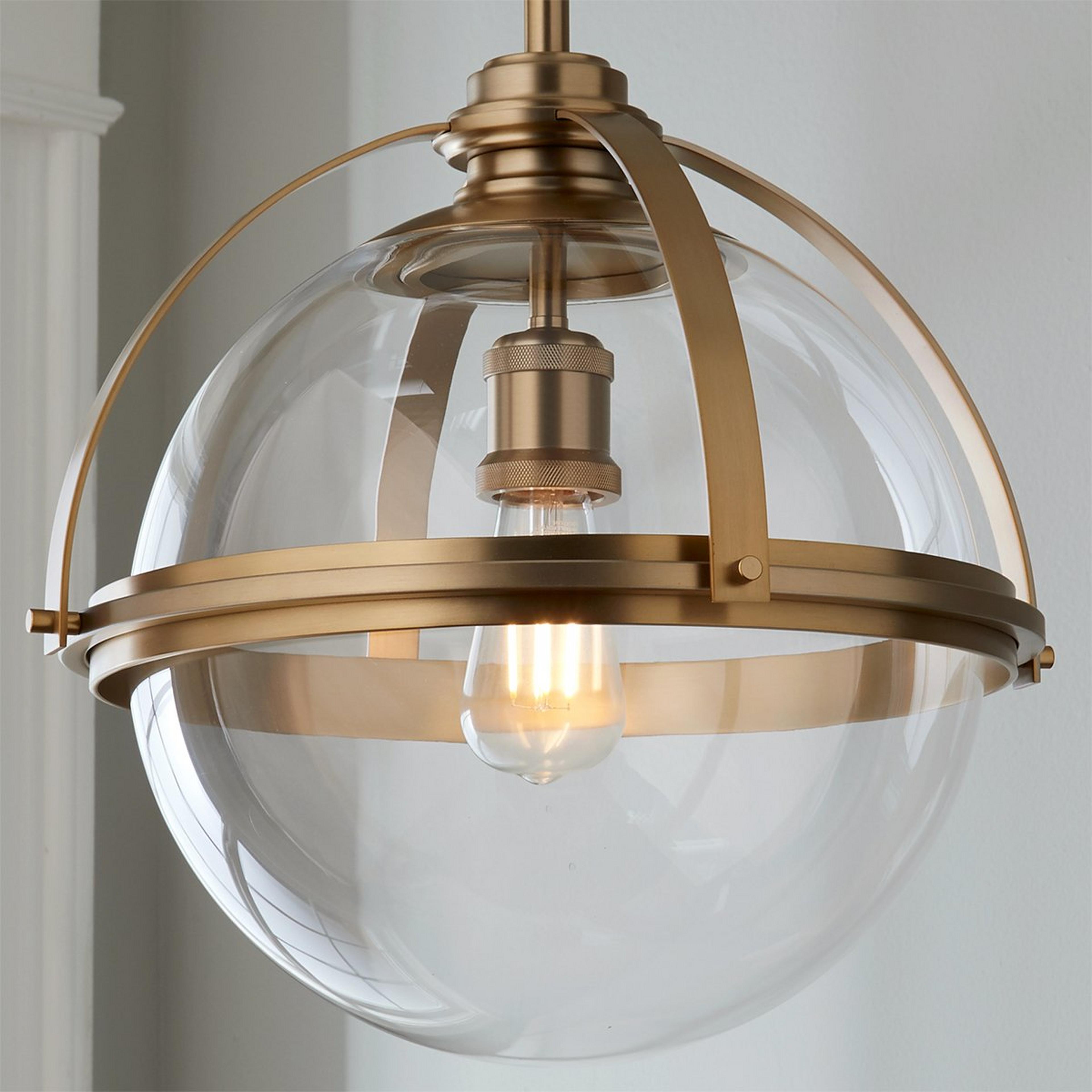 A Industrial Banded Globe Pendant - Medium with Aged Brass / Clear color