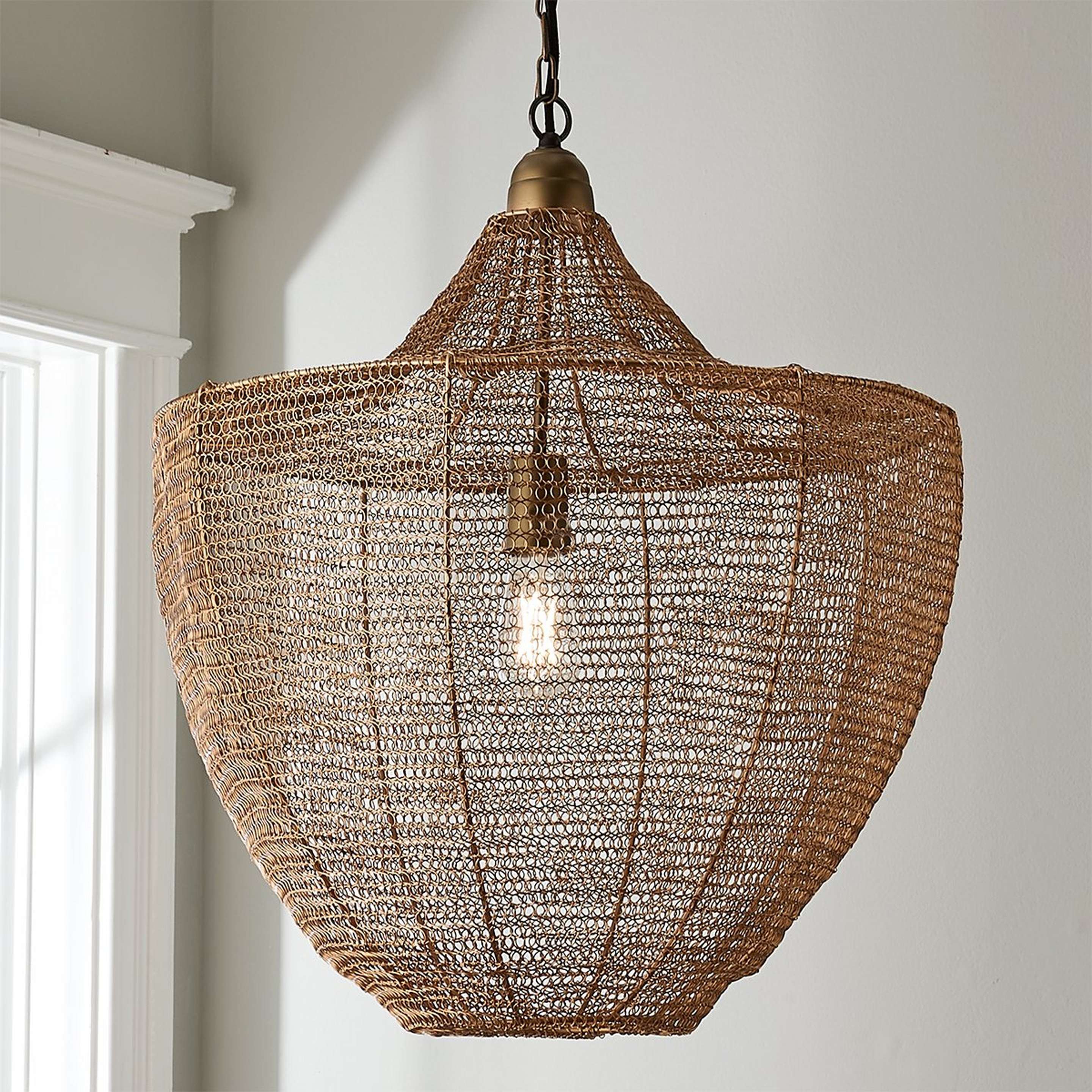 A Boho Woven Wire Pendant with Aged Brass color