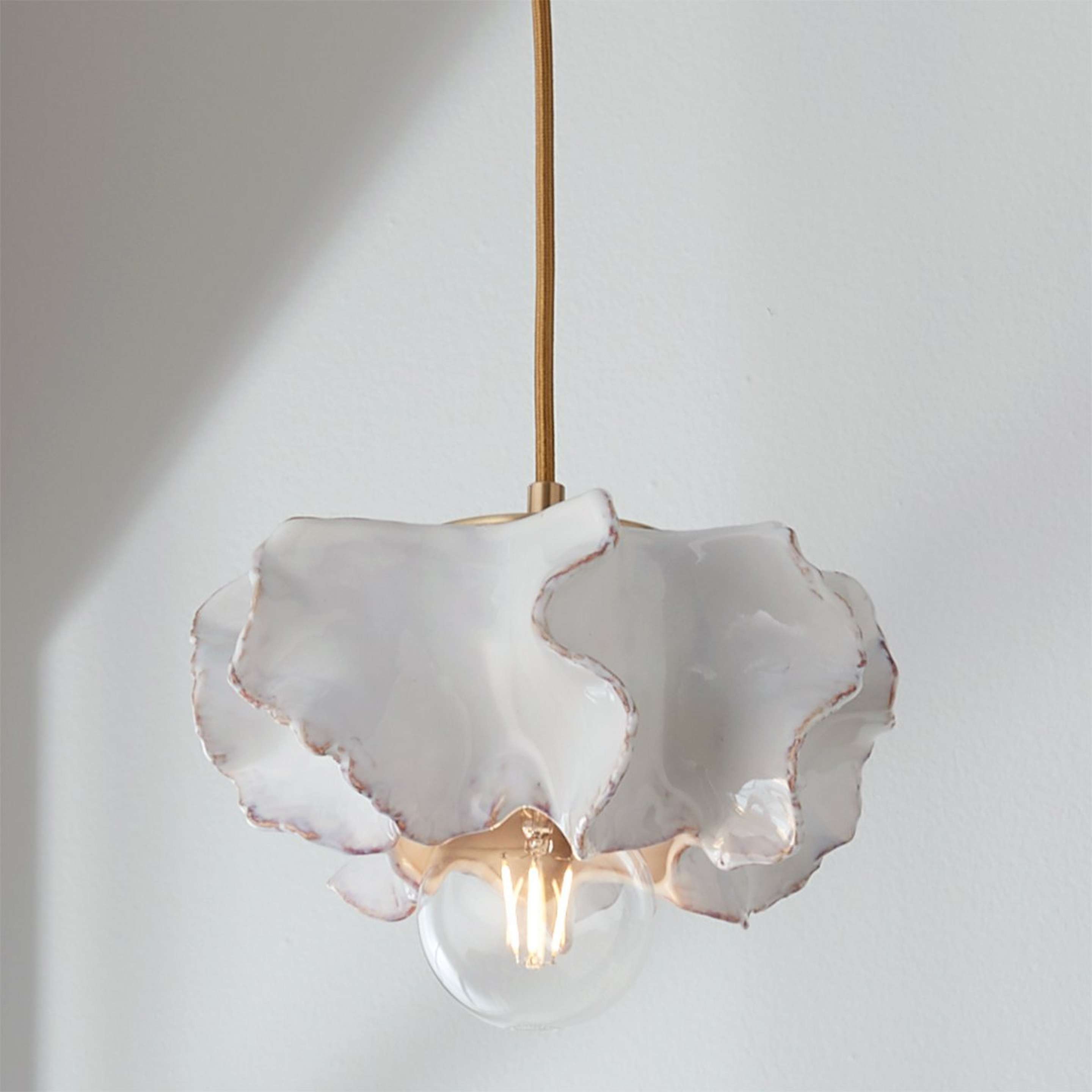 A White Ceramic Urchin Pendant with Brass / White color