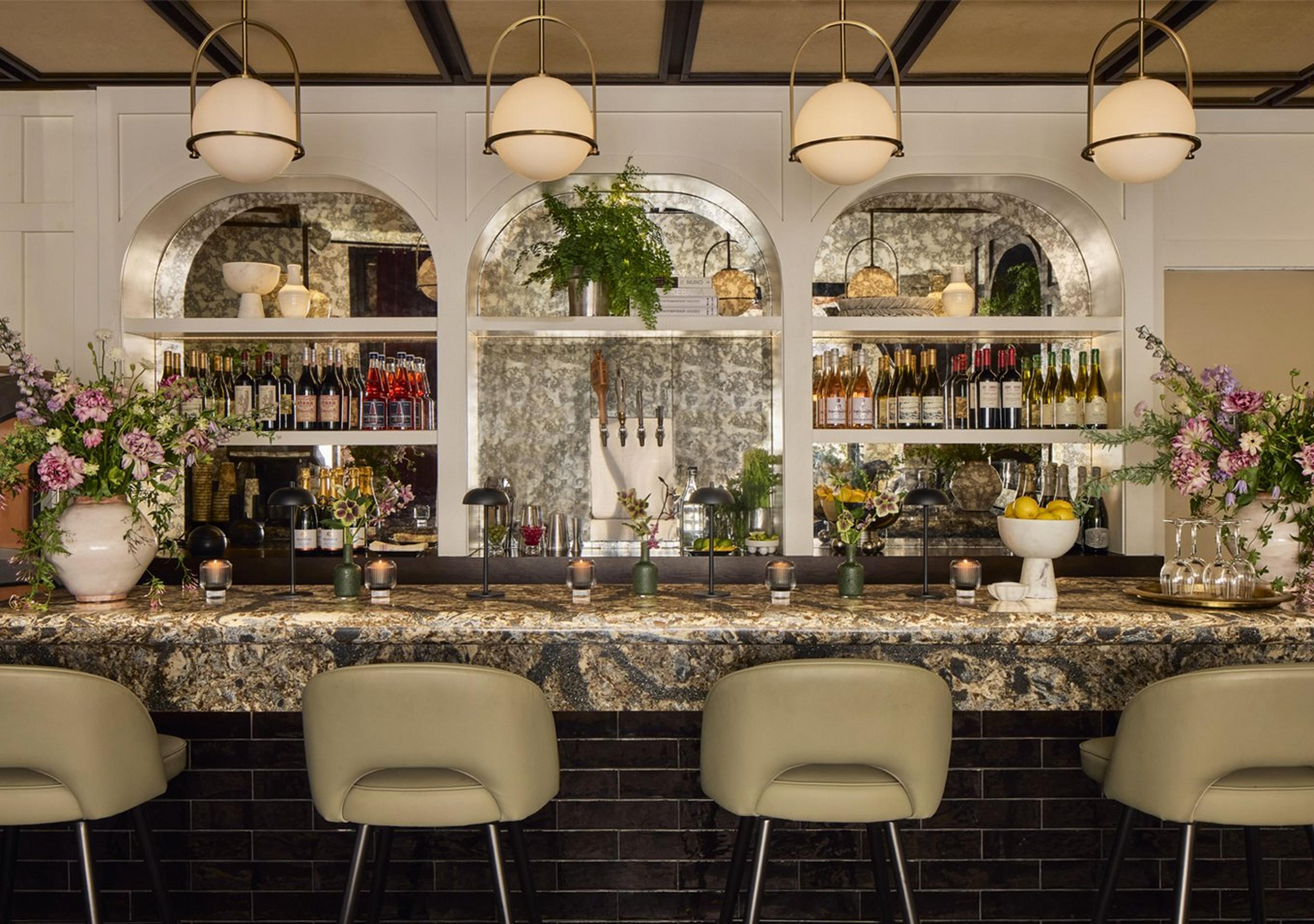 Brass Apogee Pendants above a restaurant bar