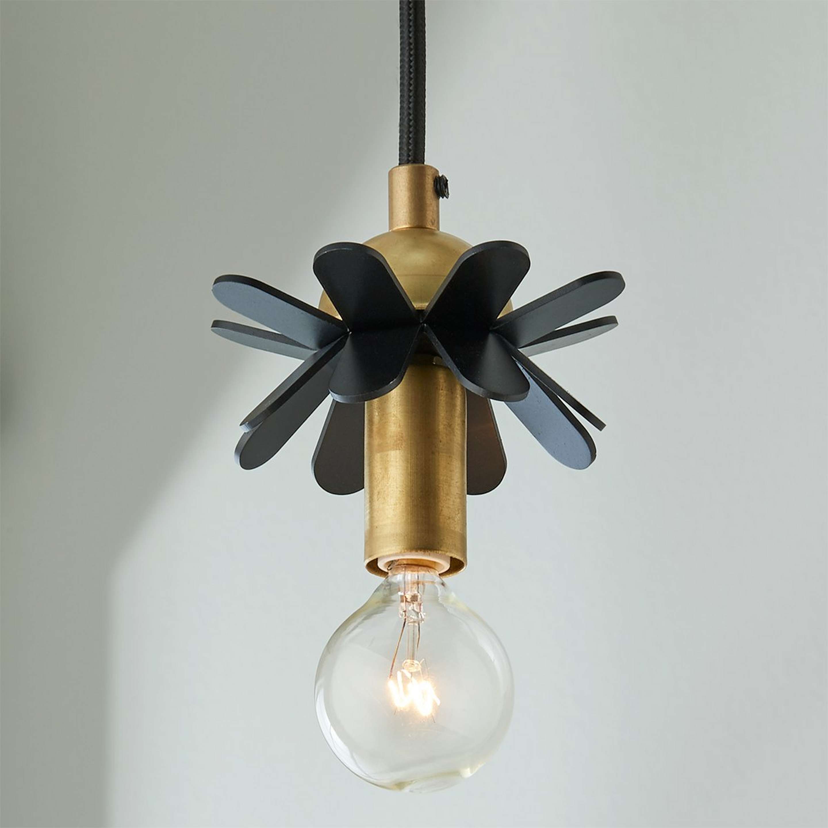 A Wendy Umanoff Mini Flower Pendant with Black / Brass color