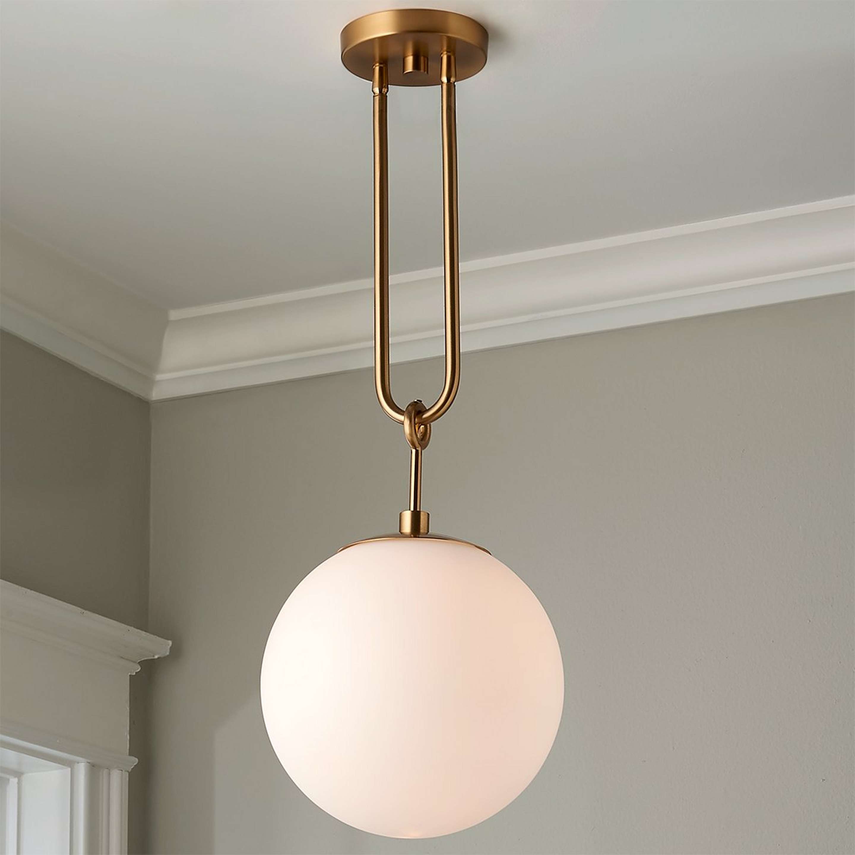 A Milky Globe Drop Pendant with Aged Brass / Milk Glass color