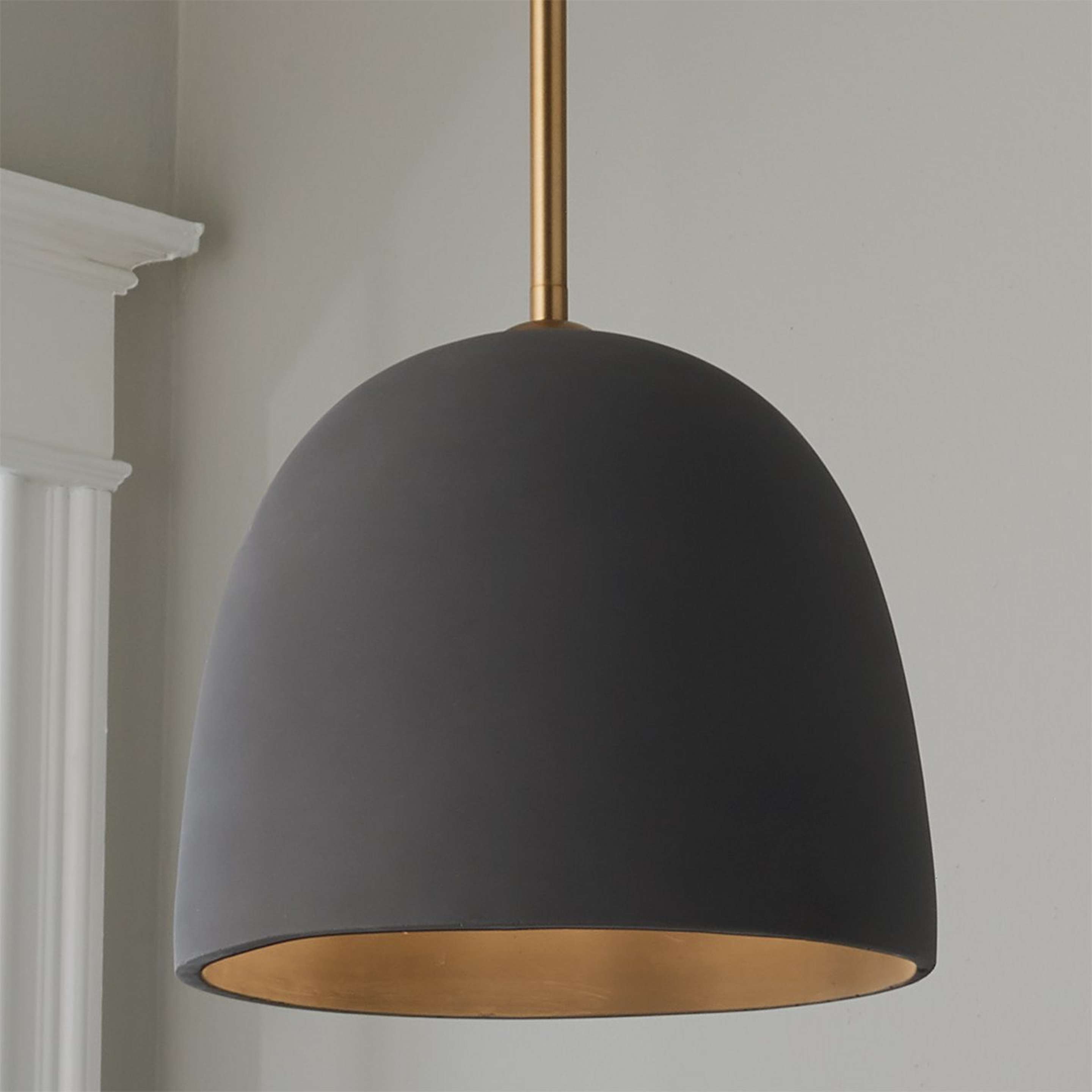 A Petra Concrete Pendant with Aged Brass / Dark Gray Concrete color