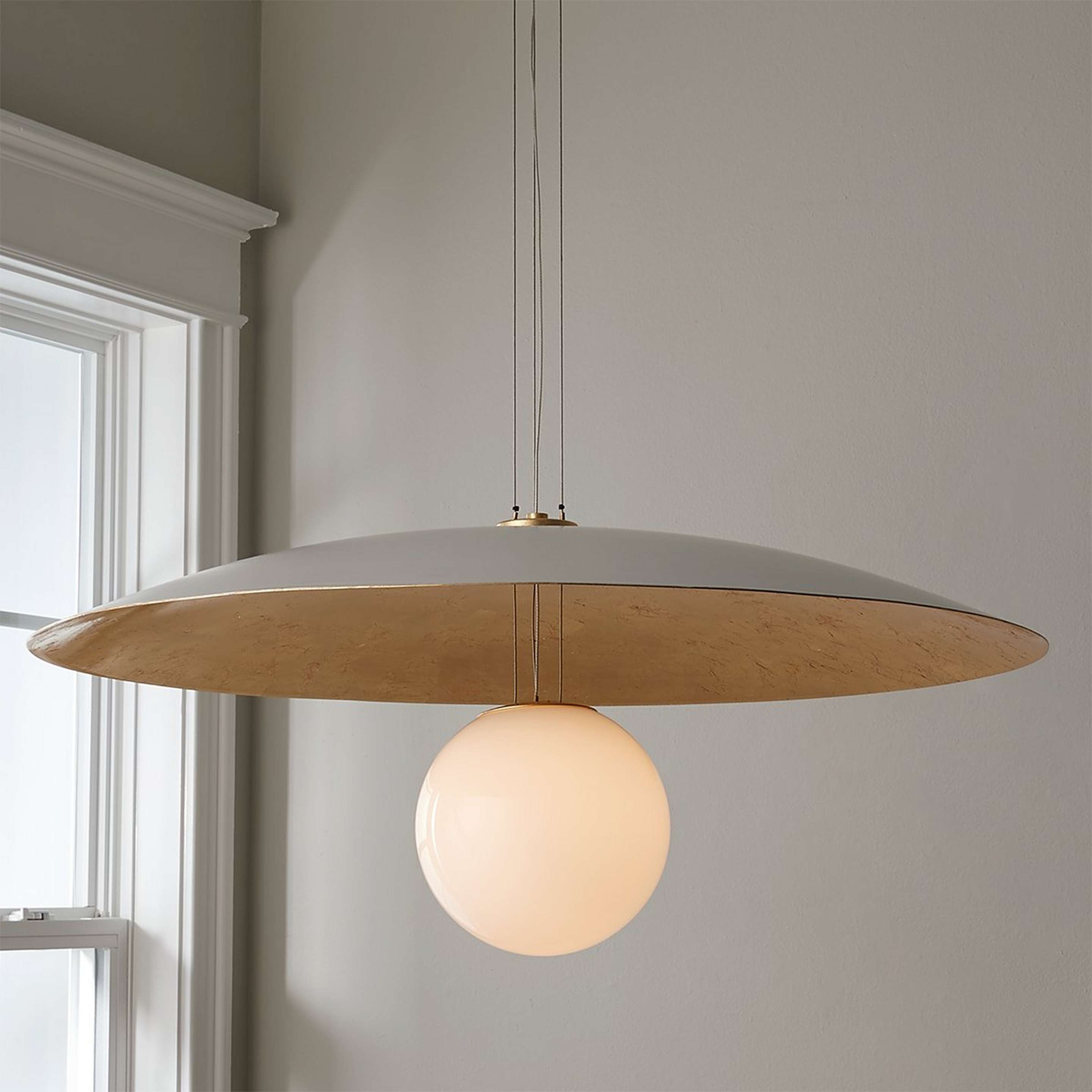 A Hover LED Pendant with Gold Leaf / White / Opal Glass color