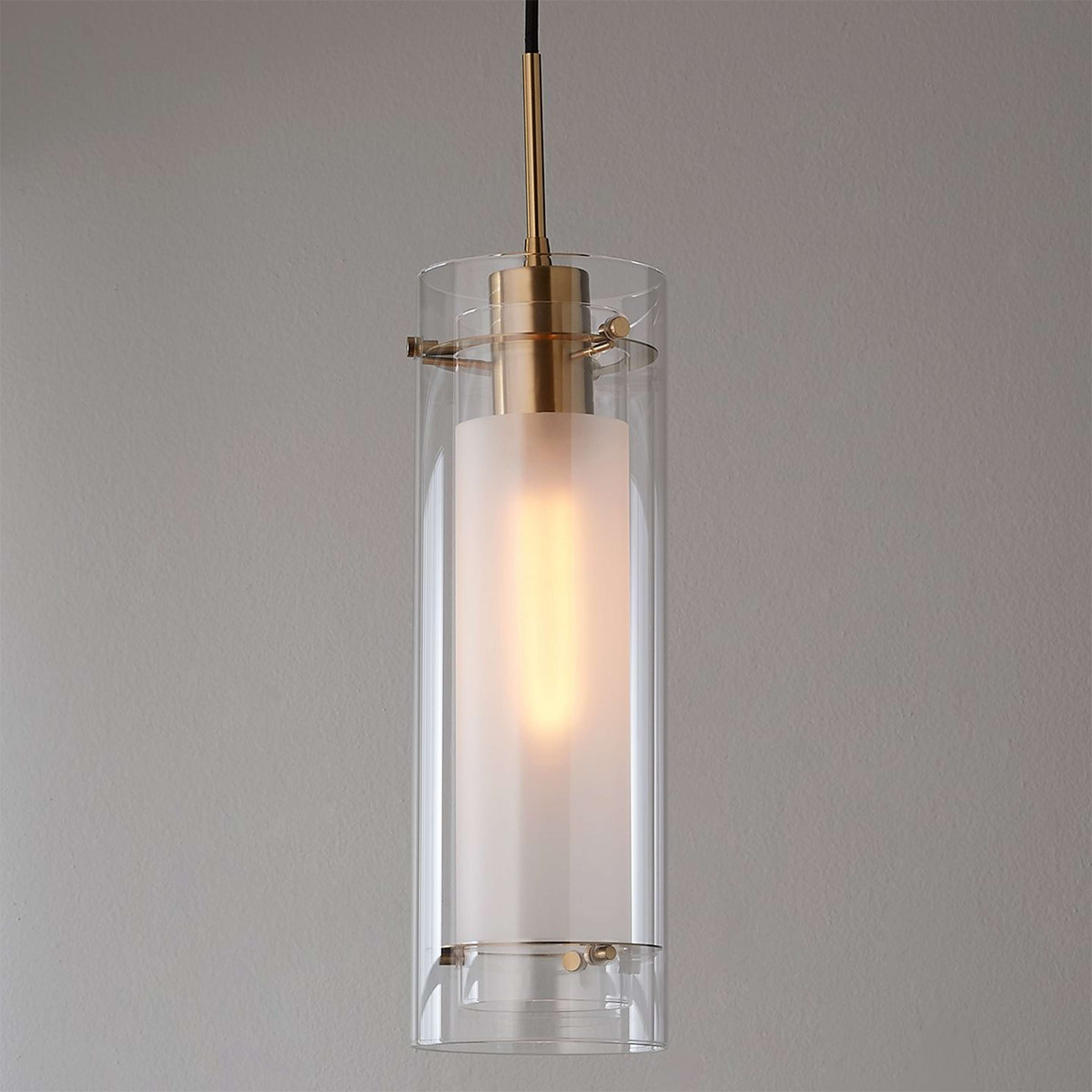A Larza Pendant with Aged Brass / Black  / Clear Glass  / Frosted Glass color