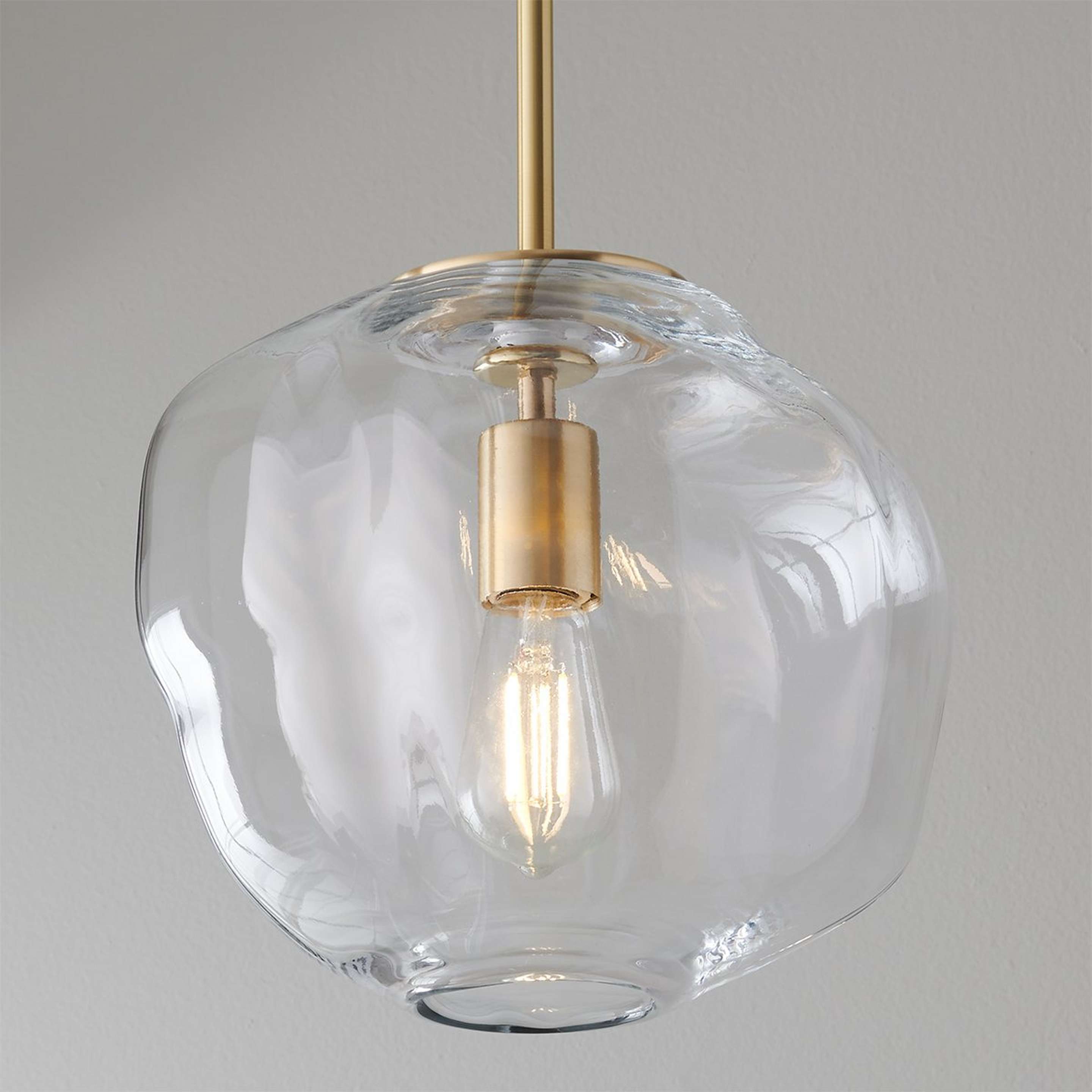 A Asymmetrical Clear Glass Pendant with Brushed Brass / Clear color