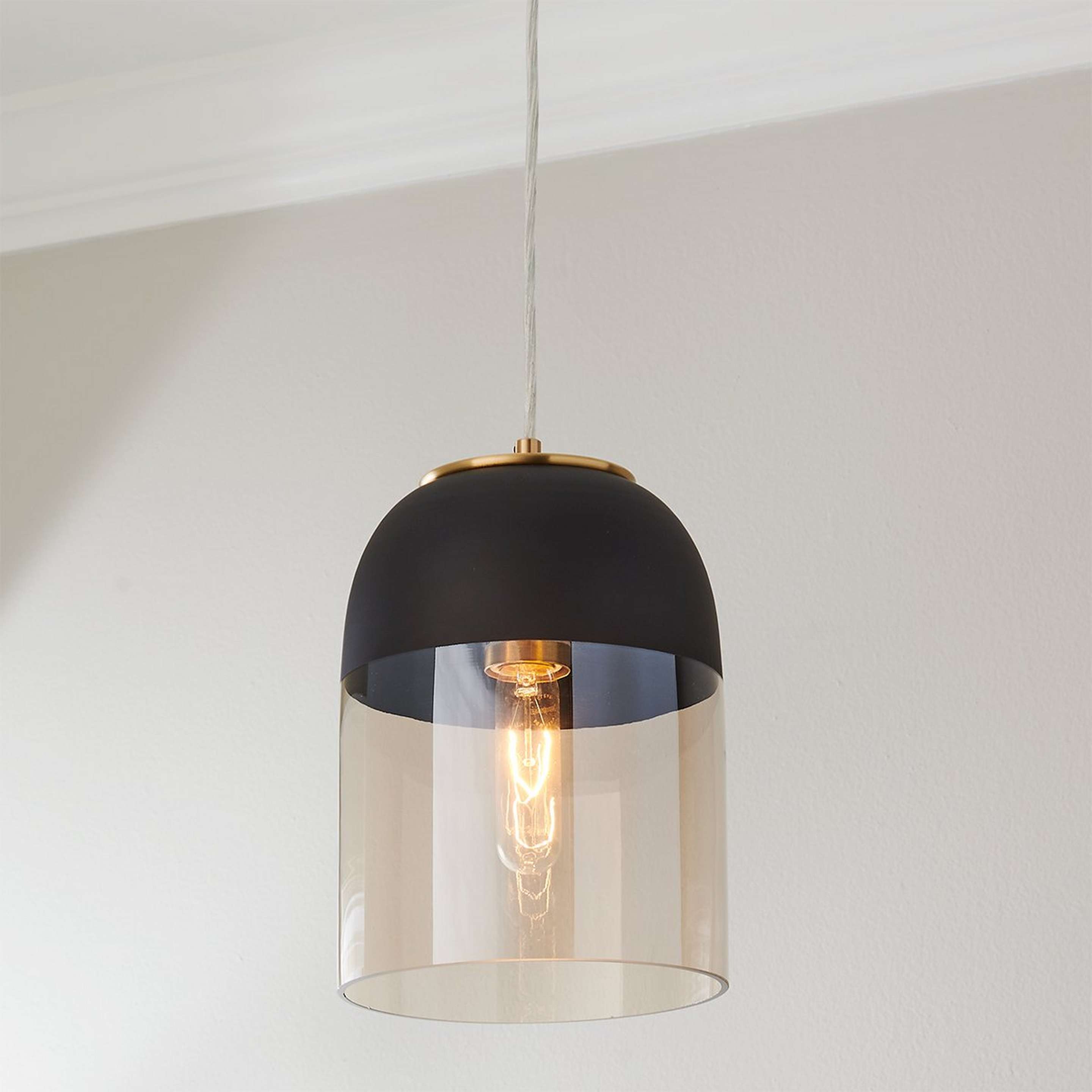 A Black Capped Amber Glass Pendant with Brushed Brass / Black / Amber color
