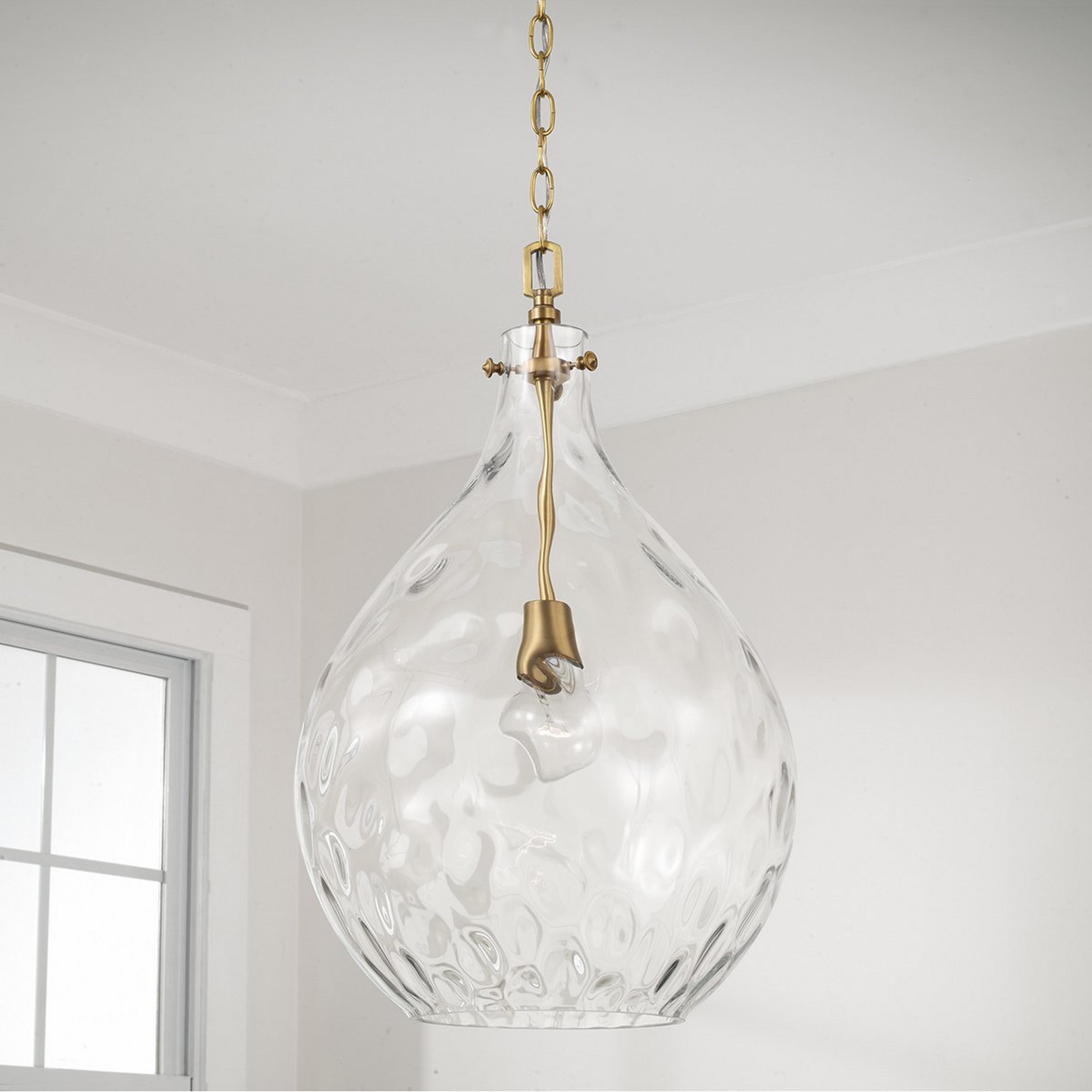 A Darby Pendant with Aged Brass / Clear Glass color