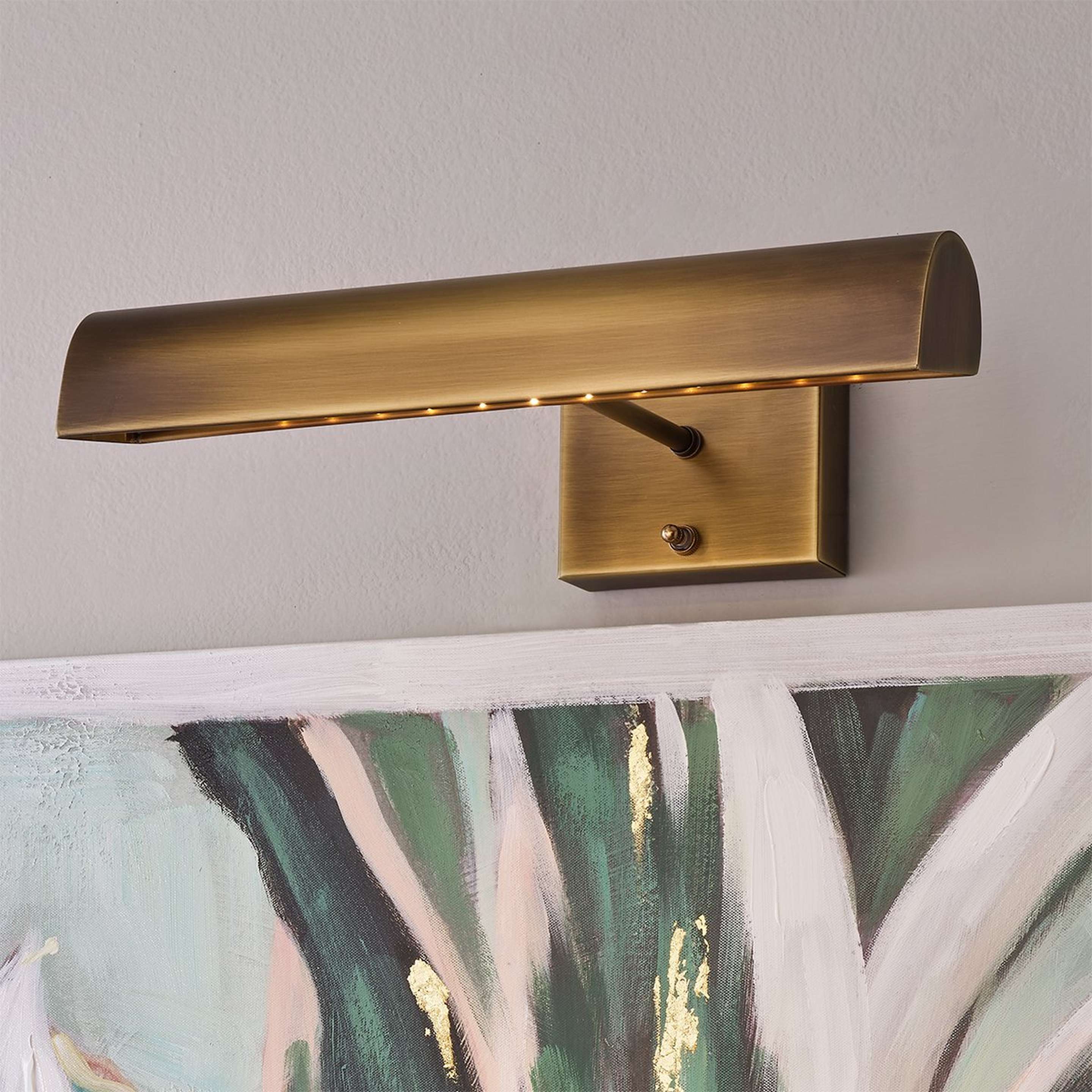 A 14" Battery Operated LED Cordless Picture Light with Antique Brass color