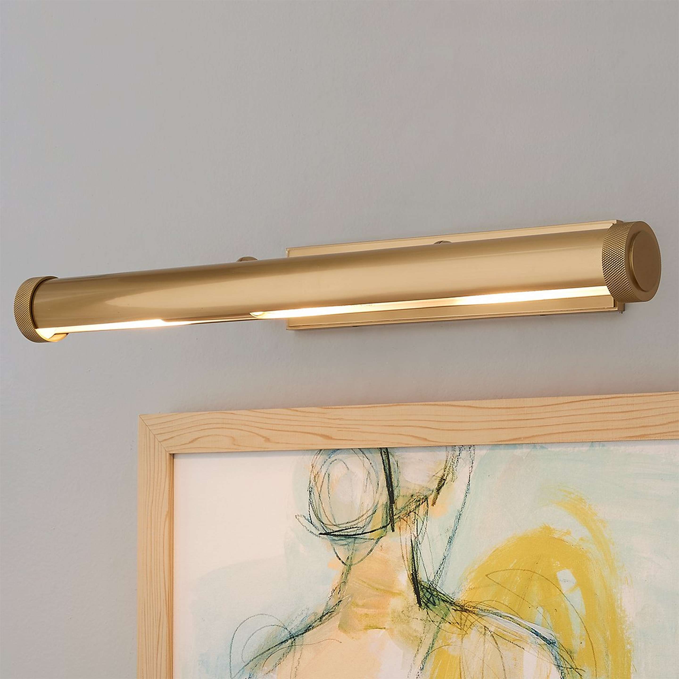A Updated Library Picture Light with Aged Brass color