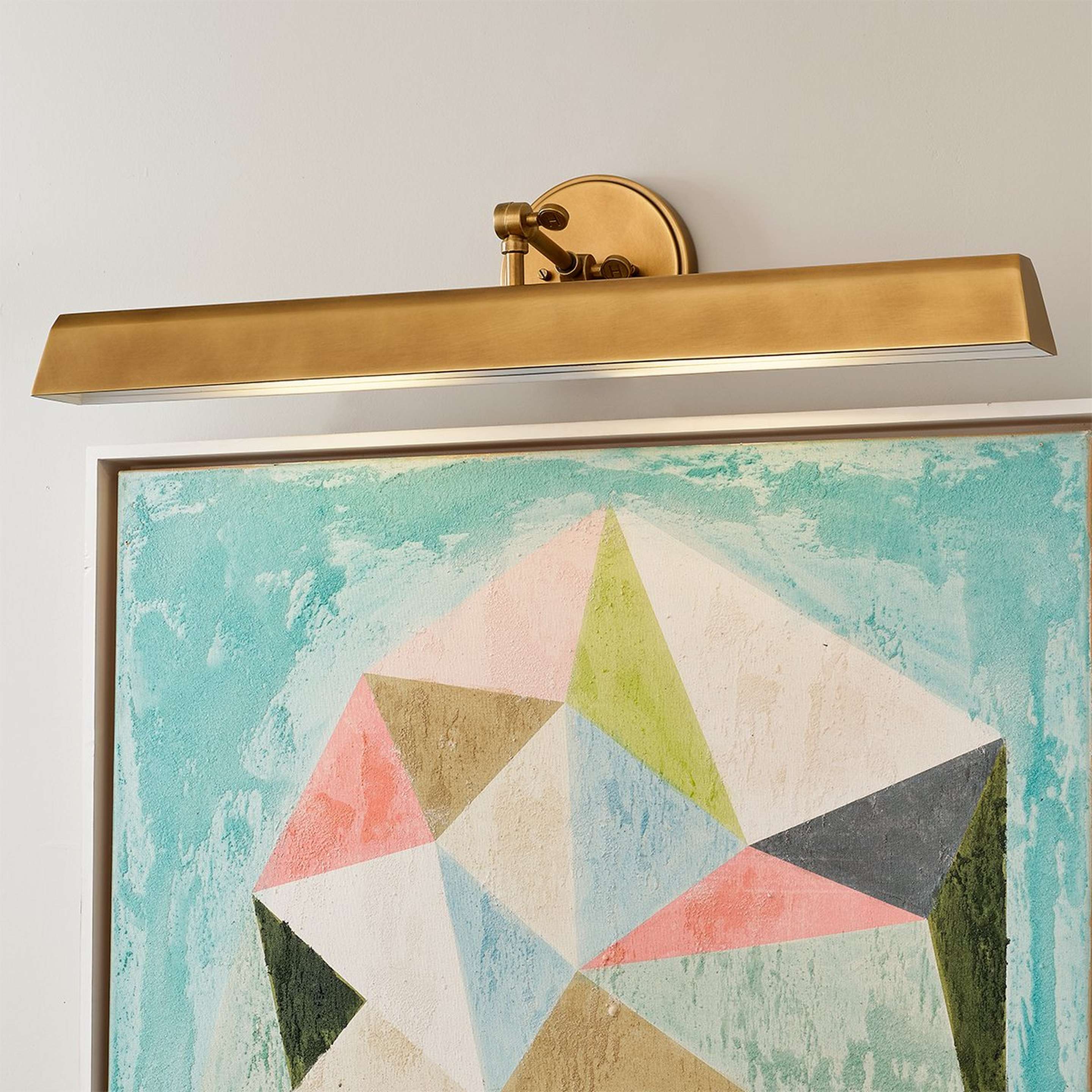 A Cyrus Adjustable Picture Light - Large with Brass color