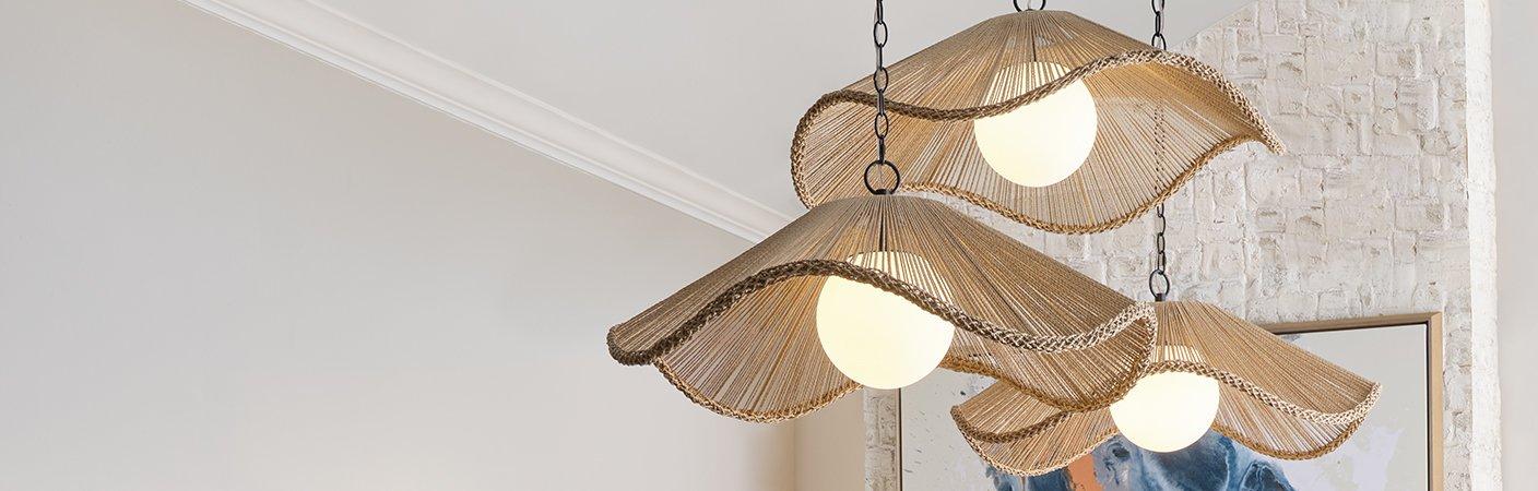 Three Currents Pendants hanging in a dining room