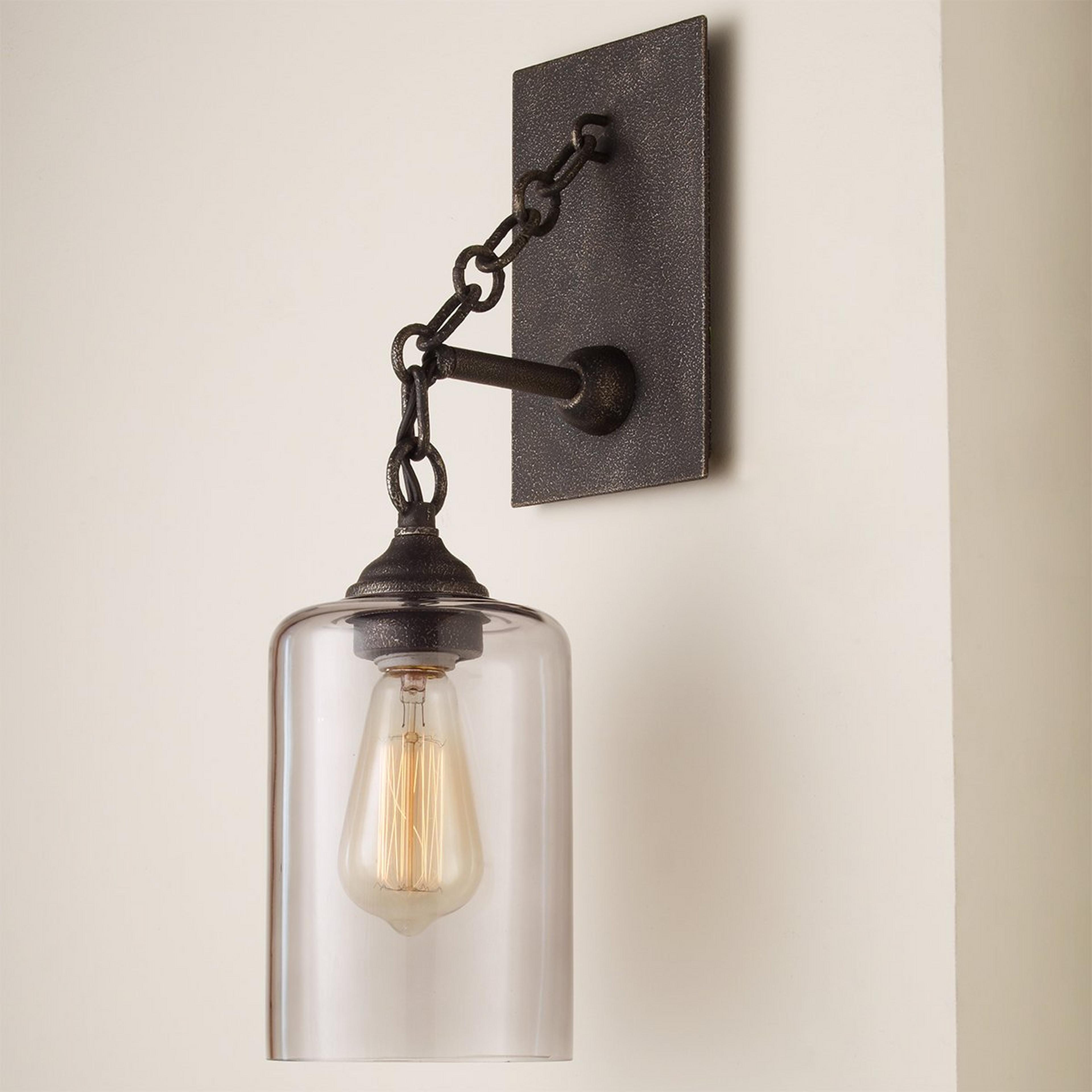 A Smoked Glass Jug Sconce with Iron color