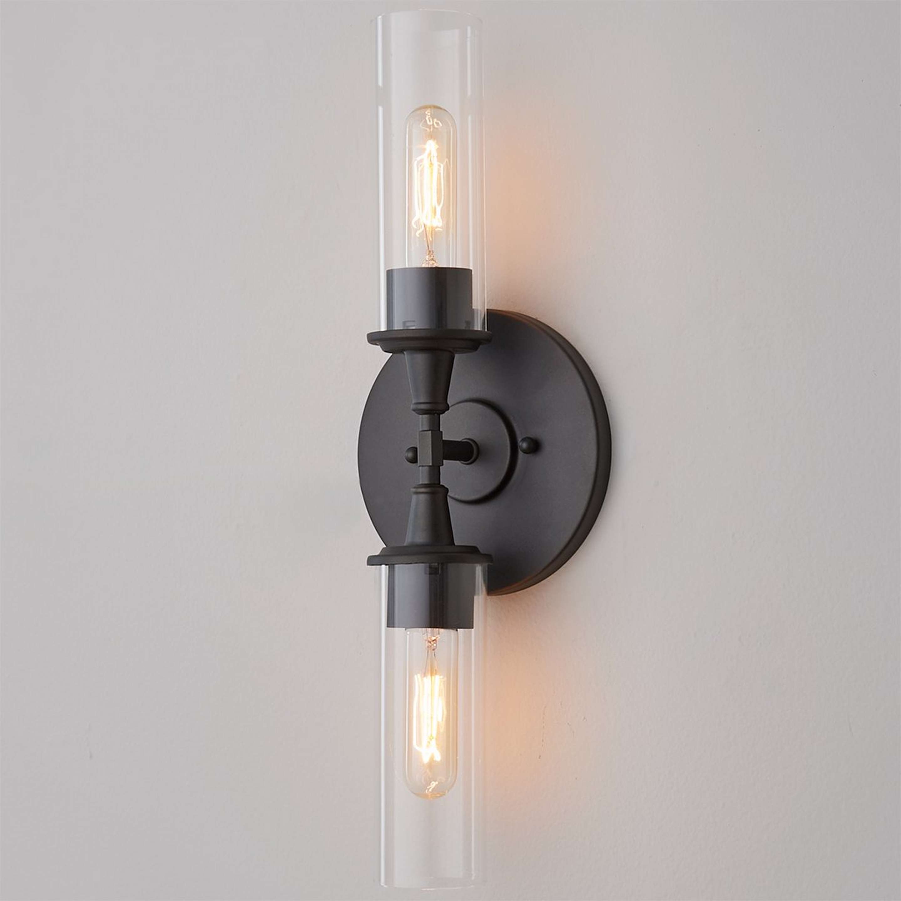A Double Bullet Glass Sconce with Bronze color